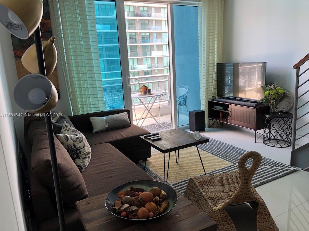 Urban living at its finest at this Brickell loft, ideally located within a distance of walking to a vibrant array of restaurants, the bustling business district of Brickell, entertainment venues, and shopping centers. This unit boasts pristine white porcelain floors that enhance the natural light, SS appliances for a modern touch, and a stylish backsplash that adds character to your culinary space. Privacy and comfort with costume design closet and drapes. The building provides a sparkling swimming pool, a state-of-the-art gym, and an activity room for social gatherings. Enjoy the convenience of the concierge-attended lobby, valet parking services, and on-site management team, dedicated to meeting your needs.