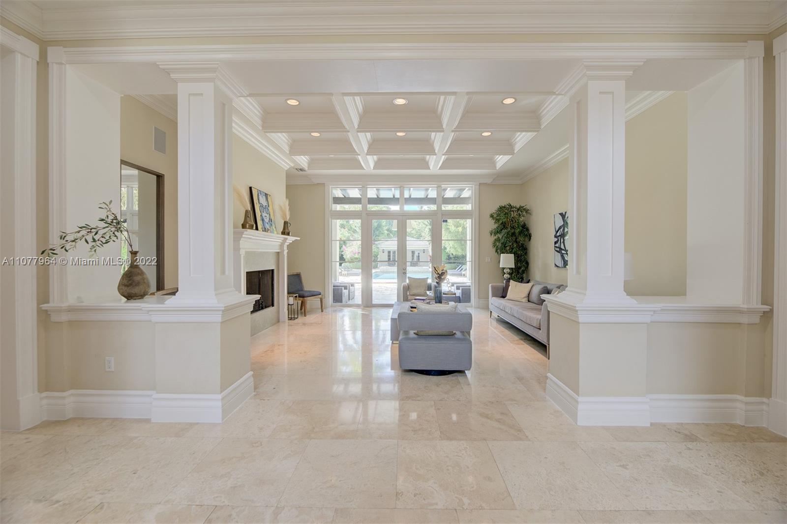 Enchanting custom built 1 acre estate in Pinecrest. The elegant grand foyer leads to a beautiful formal living room. The extensive living areas are perfect for hosting and the stunning kitchen includes Wolf brand double oven gas range with 8 burners, Miele appliances, floor to ceiling cabinetry, 1,000 bottle glass enclosed wine cellar, and a breakfast bar area. The master bedroom suite offers a welcoming sitting area, walk-in closets, spa bath with whirlpool tub and shower, and a private terrace overlooking the estate. The property also features a covered terrace with a summer kitchen, custom pool, & guest house. Additional features:  elevator, staff quarters, office, impact windows/doors, gate, and 3 car garage.  By Appointment Only.