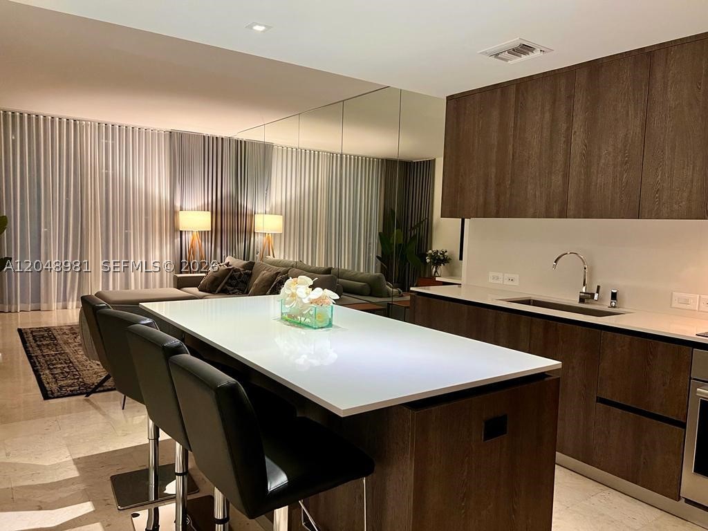 Beautiful, bright and spacious residence located in the heart of Brickell! Ceiling to floor windows, large terrace accessible from dining/living and bedroom. Top-of-the-line appliances, italian cabinetry, marble flooring throughout. Professionally decorated and designed. Elevated upgrades. Rise is a full-service luxury high-rise; Amenities include an expansive acre + deck, heated pool and spa, outdoor fitness areas, sunset deck, state-of-the-art fitness center, hammam spa, business center, entertainment suite with private video room; Rise at Brickell City Centre offers a unique and vibrant lifestyle, steps away from world-class dining, entertainment and shopping!eautiful, bright and spacious residence located in the heart of Brickell! Ceiling to floor windows, large terrace accessible from dining/living and bedroom. Top-of-the-line appliances, italian cabinetry, marble flooring throughout. Professionally decorated and designed. Elevated upgrades. Rise is a full-service luxury high-rise; Amenities include an expansive acre + deck, heated pool and spa, outdoor fitness areas, sunset deck, state-of-the-art fitness center, hammam spa, business center, entertainment suite with private video room; Rise at Brickell City Centre offers a unique and vibrant lifestyle, steps away from world-class dining, entertainment and shopping!