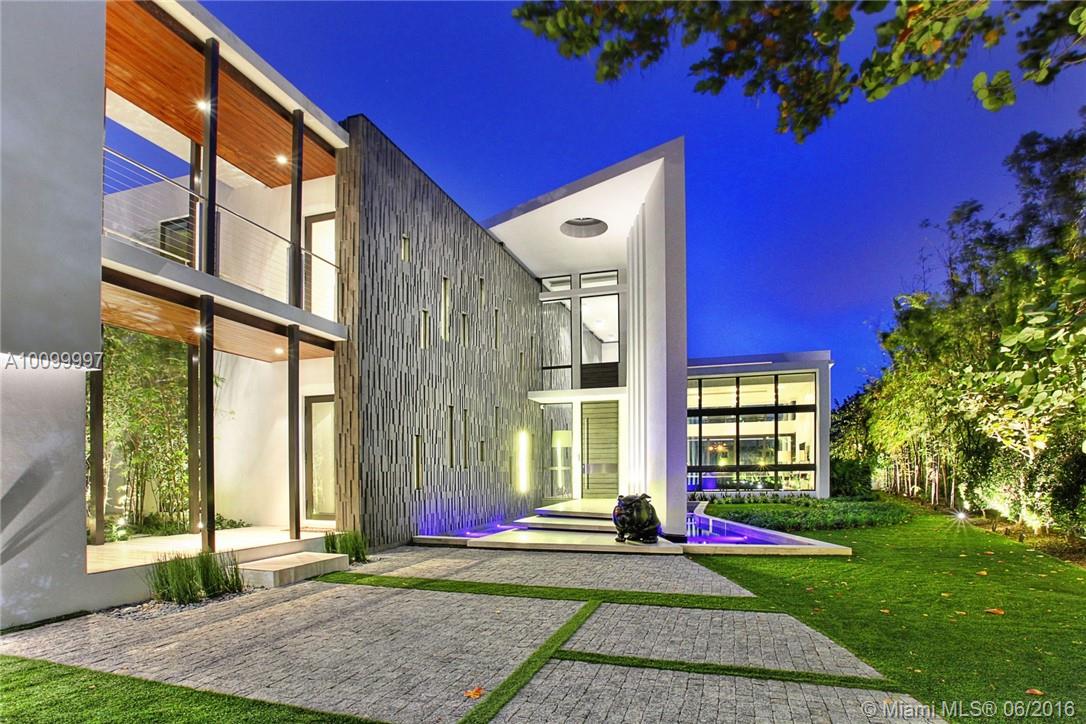 Chic modern waterfront residence designed for todays lifestyle.This home features an open floor plan w/ soaring ceilings, allowing for beautiful water views throughout. A lg covered terrace w/ modern form pool, contemporary bar, summer kitchen, cabana & endless views allow for tropical living at its finest. Amenities inc. a grand living room, gourmet kitchen, dining room, separate guest house w/ private entrance. Includes, staff qtrs, lg dock, ample parking.Investment opportunity best neighborhood.