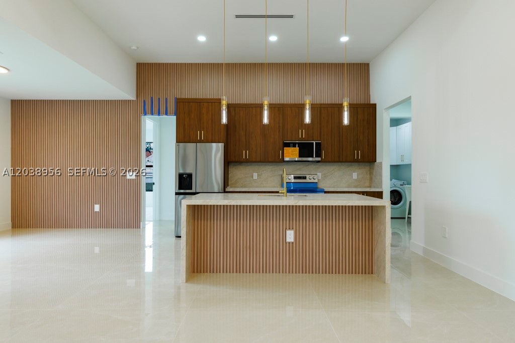 Seller Motivated – Closing Cost Assistance Available! This brand-new construction home is situated on a spacious half-acre lot in one of Lehigh Acres' most peaceful neighborhoods, offering the perfect combination of luxury, privacy, and modern living. Featuring 4 bedrooms and 3 bathrooms with a desirable split floor plan, the home showcases soaring 13-foot coffered ceilings, abundant natural light, and elegant 40x40 porcelain tile flooring throughout with no carpet. The chef-inspired kitchen includes a large pantry and flows seamlessly into the dining and living areas, making it ideal for everyday living and entertaining. The private owner's suite offers coffered ceilings, dual walk-in closets, and a spa-like bathroom. Step outside to a covered lanai complete with a built-in outdoor kitchen, perfect for enjoying Florida's year-round outdoor lifestyle. The expansive half-acre homesite provides ample space for a future pool, garden, workshop, or detached garage. Built with solid concrete block construction, impact-resistant windows, elevated above FEMA base flood requirements, whole-home surge protection, and a fully insulated two-car garage, this home delivers both beauty and peace of mind. Move-in ready and waiting for its first owner, this exceptional property also includes seller contributions toward the buyer's closing costs, making it an outstanding opportunity for today's homebuyer.