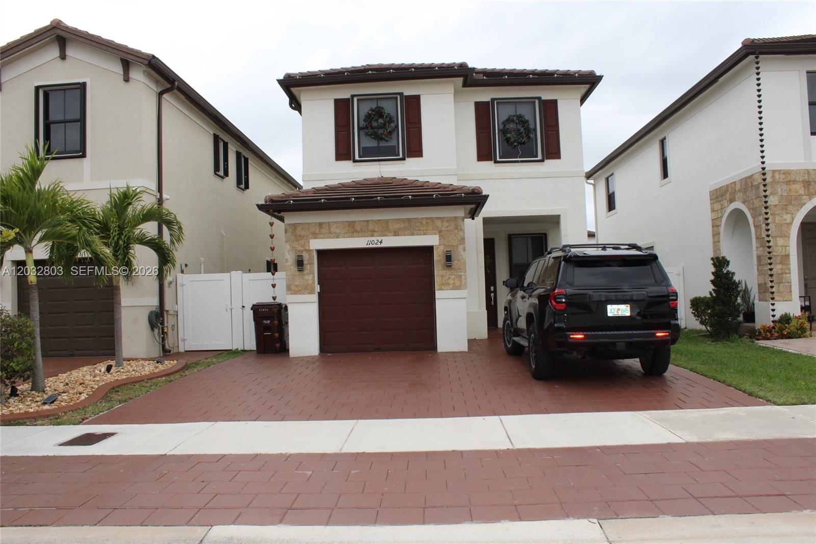Experience luxury living in the highly sought-after gated community of Aquabella! This fully upgraded two-story home features 4 spacious bedrooms, 2.5 bathrooms, and an oversized lot with a 5-car driveway. No expense was spared in this beautifully renovated home. The first floor showcases sleek porcelain tile flooring throughout, along with a modern kitchen featuring quartz countertops and a stunning island. Upstairs offers luxury waterproof vinyl flooring, custom-built closets, and a designer bathrooms. All bedrooms include custom blinds with blackout shades for ultimate comfort and privacy. The backyard has been completely transformed into the perfect entertaining space with a pergola, ideal for gatherings and holiday celebrations. Convenient visitor parking is located nearby for added ease. This turnkey property truly has it all - style, comfort, and functionality. Don't miss your chance to own this exceptional home in Aquabella. Schedule your showing today before it's gone!