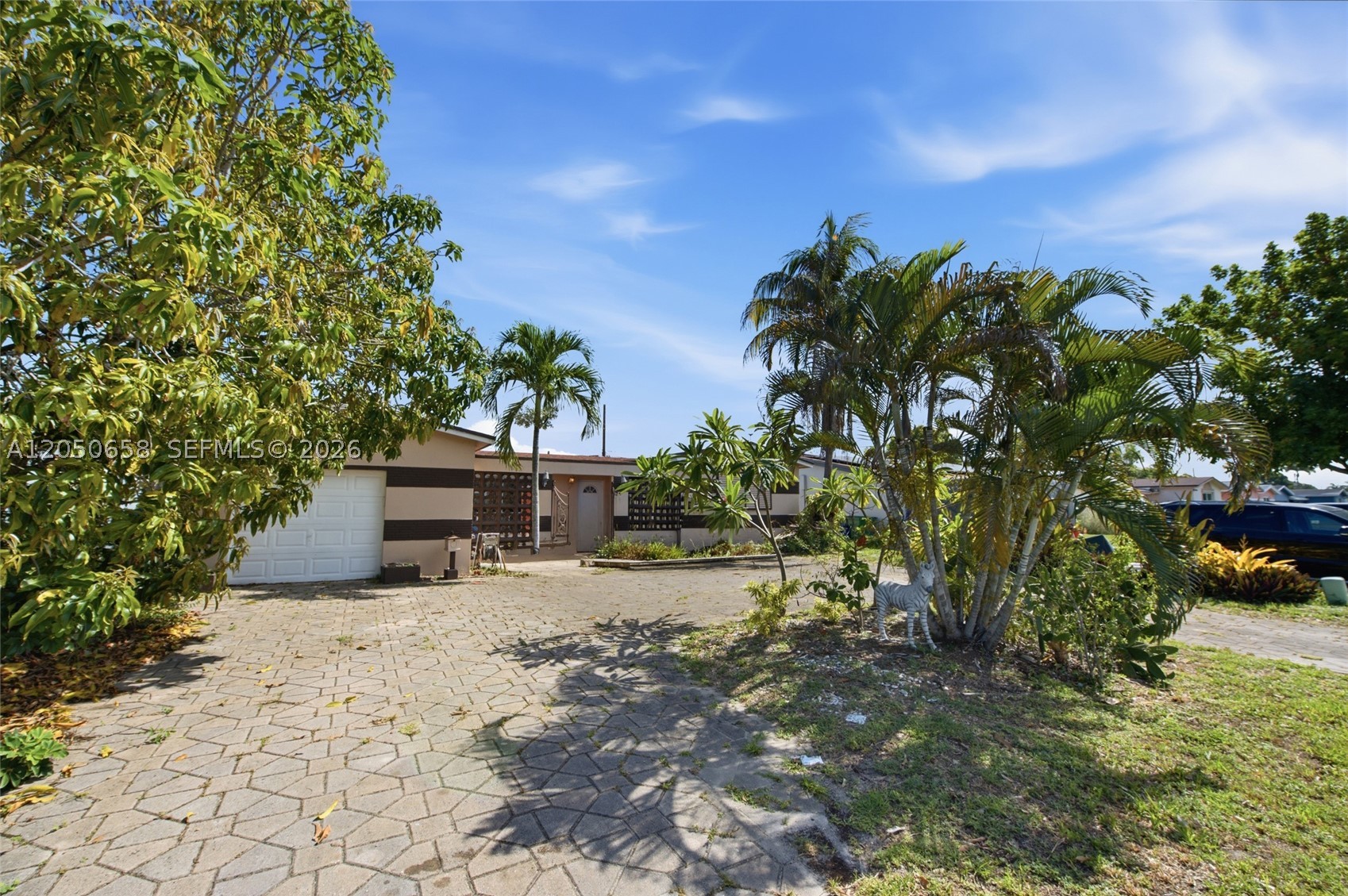 Spacious Florida-style 3-bedroom, 2-bath home with a one-car garage, private in-ground pool and covered outdoor living area. Designed for indoor-outdoor living, the home features a cabana bath and sliding-glass doors connecting the primary bedroom to the pool and patio. Additional features include one-story CBS construction, tile flooring, a paver driveway and a composition-shingle roof replaced in 2016. Conveniently located The pool is currently drained. No HOA. An excellent opportunity to personalize the home and make it your own. Conveniently located near parks, schools, shopping, dining, Miramar Parkway, University Drive and Florida’s Turnpike.