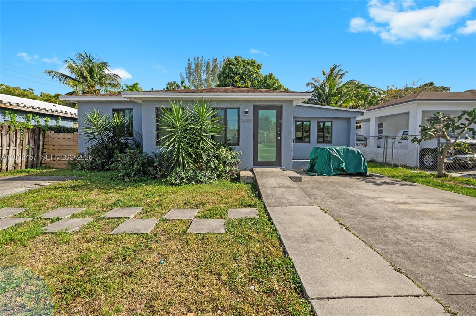 Charming split floor plan single-family home with modern upgrades! Pet-friendly with a built-in doggie door and no HOA approval required. Features 2 bedrooms and 1.5 bathrooms plus a versatile 10’ x 24’  room—ideal as a 3rd bedroom, home office, den, or fitness space.  Enjoy a spacious Florida Room and a large, fully fenced backyard with a detached hot tub, perfect for entertaining or relaxing outdoors. Property includes fiber internet, newer roof (2018), impact windows (2018) for added efficiency and security, and AC system (2018).  Two concrete parking pads provide ample space for vehicles. Conveniently located near I-95, Downtown Hollywood, and Fort Lauderdale-Hollywood International Airport, and just 3 miles from the beaches. Only 2 blocks from Downtown Hollywood’s shops and restaurants.
