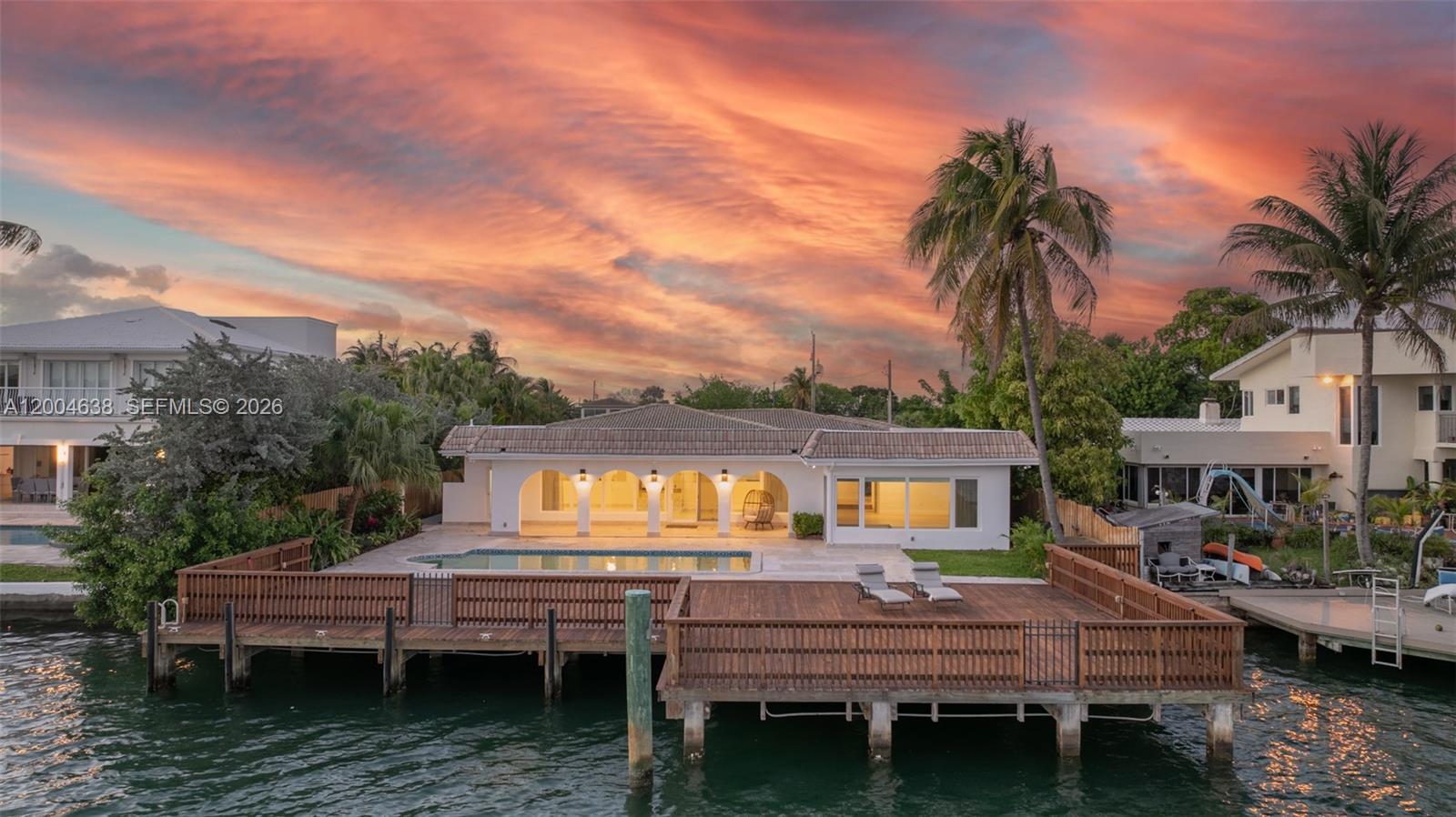 Enjoy waterfront living on Biscayne Bay in this one-story home located in the gated community of Biscayne Point. Set on a 12,000 SF lot with 80 FT of direct bay frontage, this property offers privacy, space, and open water views. The home features 4 bedrooms, 4 bathrooms, and approx. 4,315 SF of living area. Inside, the open layout is filled with natural light and upgraded with a brand new kitchen with custom cabinets and top line appliances, built for both daily living and entertaining. The primary suite offers a comfortable retreat with two walk-in closets and a brand new bathroom with a clean, modern finish. The home has been freshly painted and updated with new lighting throughout, giving it a sharp, move-in ready feel. Outdoor areas are designed for both relaxation and hosting. The pool has been resurfaced and includes brand new equipment and a heater. The large patio connects to an expansive approx. 1,811 SF private dock, one of the largest on the island, with direct bay access and open views, ideal for boating and sunset gatherings. Located minutes from the beach and the Bal Harbour Shops, this property offers a complete Miami Beach lifestyle. Move-in ready and fully upgraded, this home is a rare opportunity to own a true waterfront property in one of the area’s most private communities.