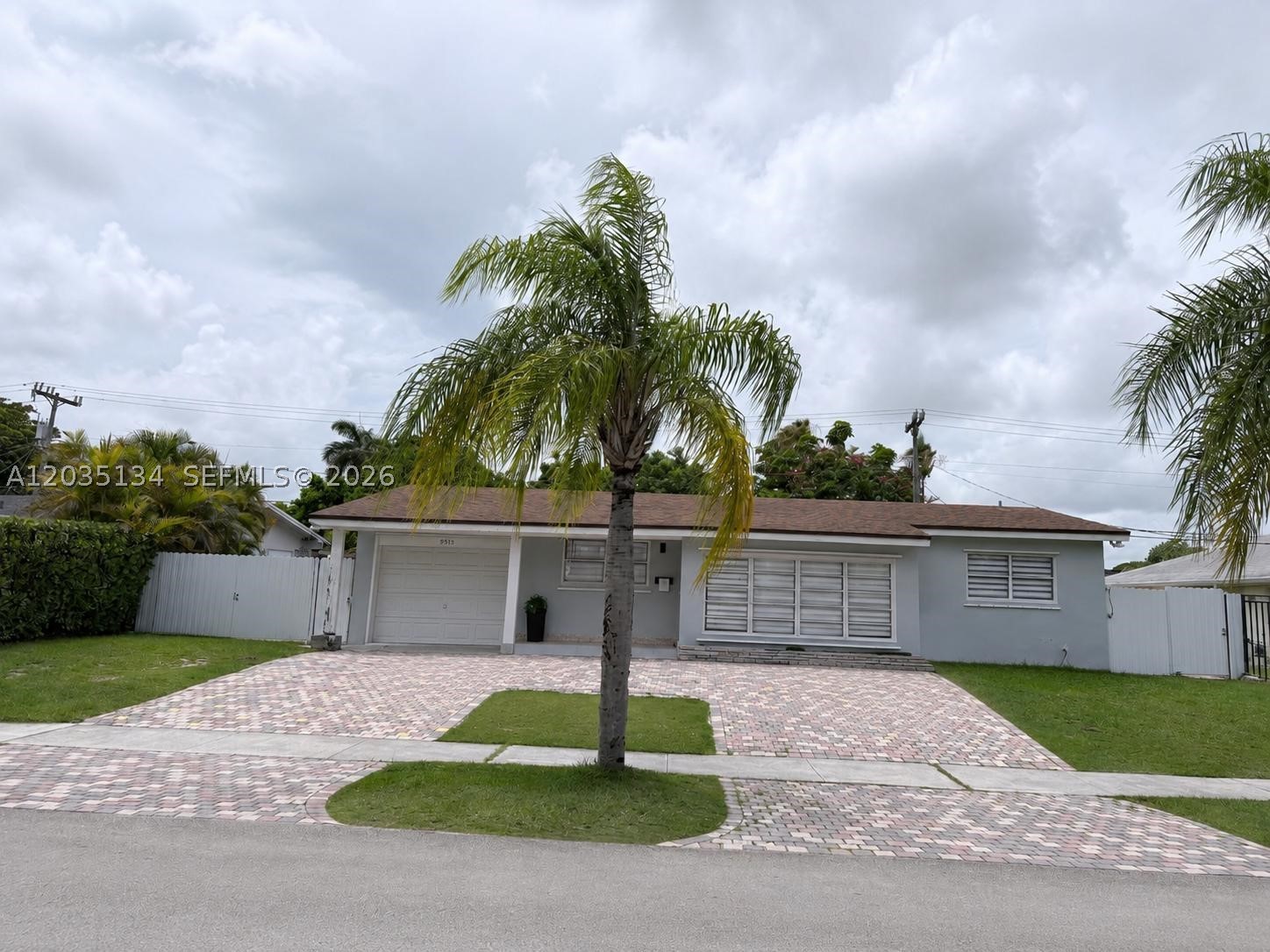 Beautifully updated 3 bedroom, 2 bathroom home in the heart of Cutler Bay with exceptional versatility and income potential! This move-in ready residence features a bright open floor plan, spacious living areas, a renovated kitchen with white shaker cabinetry, stainless steel appliances, updated bathrooms, tile flooring throughout, recessed lighting, and modern finishes. Enjoy outdoor living in the expansive screened-in patio overlooking a private, fully fenced backyard with paver hardscaping perfect for entertaining or relaxing. A standout feature is the converted garage, thoughtfully set up as an in-law quarters with excellent income producing potential or ideal for extended family, guests, or a home office. Additional highlights include an oversized paver driveway, side access, and a storage shed. Conveniently located near schools, parks, shopping, dining, and major highways. Don't miss this unique turnkey opportunity!