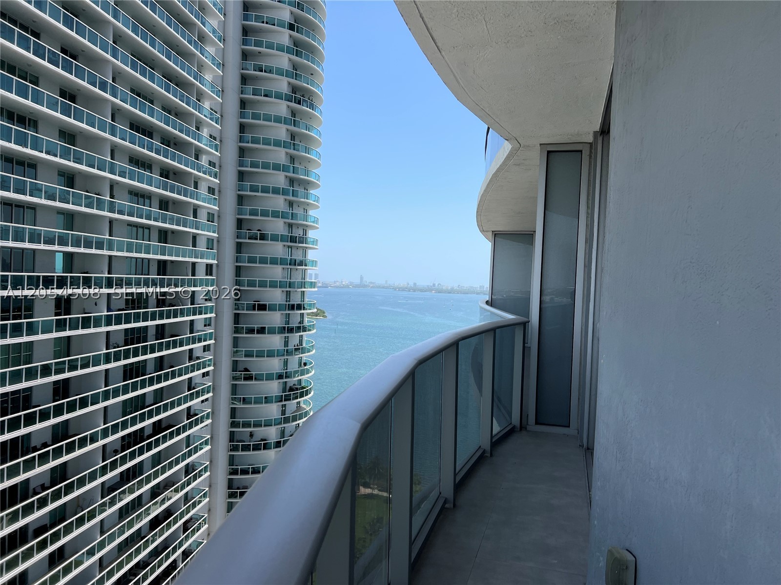 Experience luxury WATERFRONT living at ARIA ON THE BAY in this stunning split plan 2 bedroom, 2.5 bath residence.  This bright and spacious home features floor to ceiling impact windows, an open concept layout, seek modern finishes, a gourmet kitchen with premium appliances and cooking island, generous walk-in-closets, and a large private balcony with beautiful Biscayne Bay and City Views.  Enjoy a resort style amenities including sunrise and sunset pools, spa, state of the art fitness center, yoga studio, movie theater, business center, children's playground, BBQ area, valet parking, 24 hour concierge, and an impressive grand lobby. Ideally located in the heart of Edgewater, directly across from Margaret Pace Park and just minutes from Wynwood, the Design District, Midtown, Brickell, Downtown Miami, Miami Beach, world class dining, shopping, and entertainment.