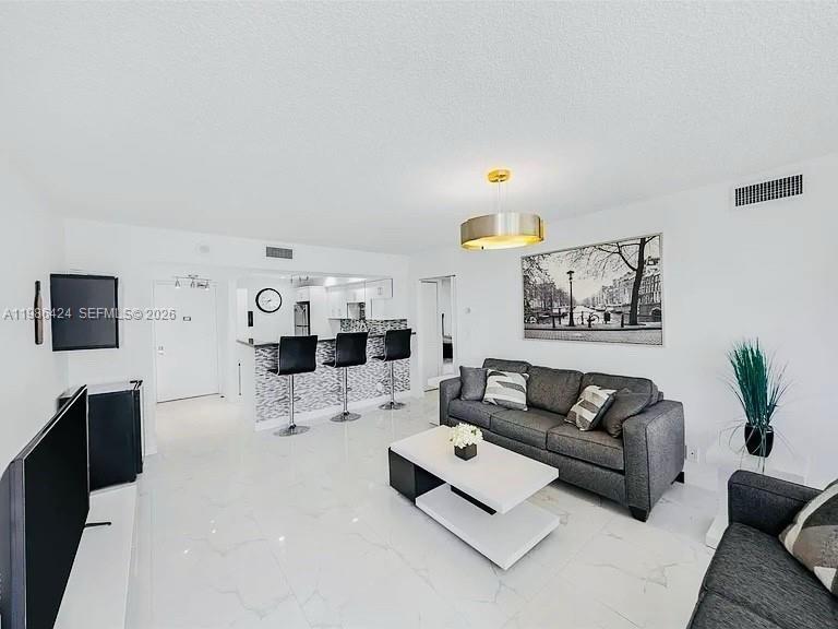 Spacious 2 bed, 2 bath corner unit in the Coronado community in Aventura with 1,313 sq ft and great natural light from multiple exposures. The unit features tile floors throughout and an open kitchen with quartz countertops that flows nicely into the dining and living areas. It’s being offered furnished, so it’s an easy move-in ready experience if furniture is wanted. Enjoy open views of the amazing Turnberry golf course, lake, and even some ocean. The building offers a pool, gym, clubhouse, gated entry, and on-site management, plus 1 assigned covered parking space. Conveniently located minutes away from the iconic Aventura Mall, Restaurants, Banks, Supermarkets, etc. Leasing is allowed after 1 year of ownership, subject to association guidelines and availability.