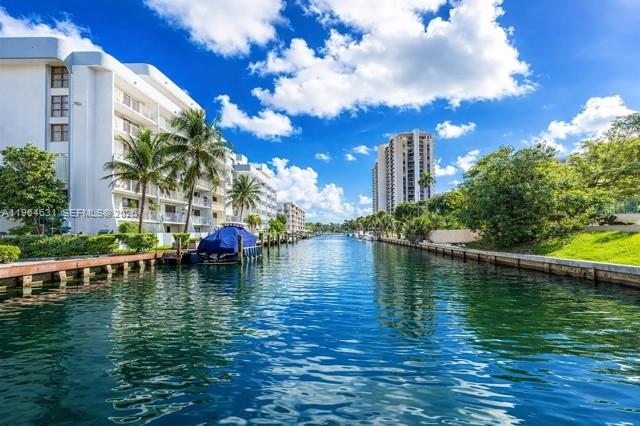 CASH OFFERS ONLY! Live next to the water and THRIVE! Coastal Garden Retreat! Fabulously-rare end-corner unit and on the 1st-Floor at The Cricket Club House....'quiet and tucked-away" yet conveniently close to everything! Feels more like a private home than a condominium, with a private entry, no lobby access, and an assigned parking space directly beside the unit, offering an effortless indoor–outdoor lifestyle with a private 'outdoor living room'/patio and garden area just 15 steps from the water’s edge and boat docks and peaceful views...ideal for boaters, kayakers, and waterfront enthusiasts. Enjoy 2 TRUE bedrooms with a split-plan layout, and 2 full tastefully updated bathrooms.  Open the doors on breezy days and enjoy gentle coastal air flowing through the space.  Lots of natural light throughout. Designed for ease and privacy.  Boat slips available (waiting period - none available now) enhance the appeal for those seeking the ultimate South Florida coastal lifestyle. This unique living sets it apart from any others!  This is the largest 2 bedroom + 2 bath unit w/outdoor living room with direct access to water view and additional parking …closest to Miami Shores, Biscayne Park, and Bal Harbor….on ground level + no stairs+no need to go into a lobby nor elevators to bring in groceries, etc., with a parking spot within steps of the unit.
