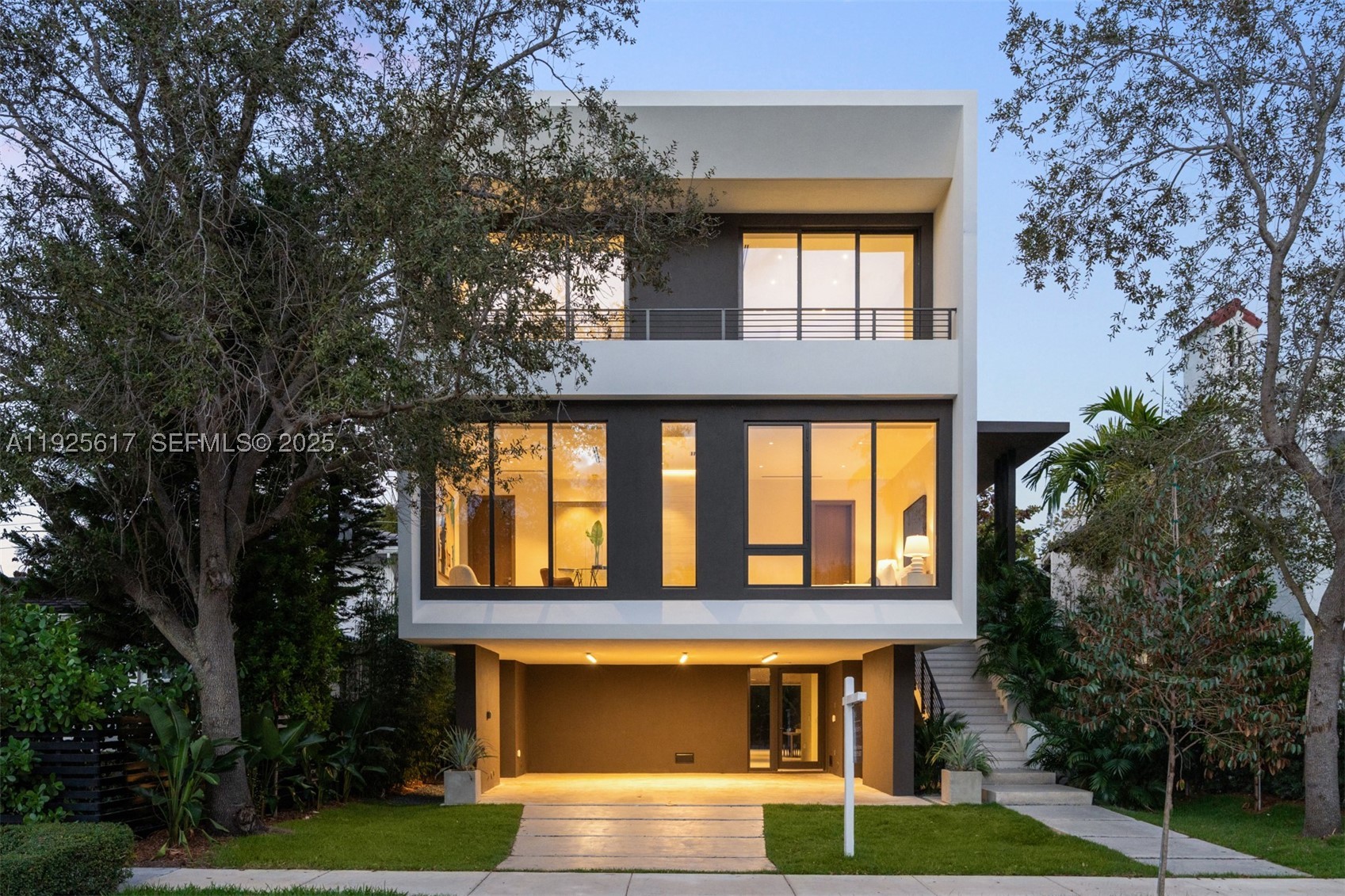 Experience elevated luxury in this exceptional Coconut Grove residence, where open-concept interiors, bespoke built-ins, and refined finishes define effortless sophistication. This 5BR/5.5BA home features a gracious family room and private elevator, crafted with timeless elegance. The first-floor summer kitchen enhances seamless indoor-outdoor living, while the spectacular rooftop terrace offers sweeping bay views and the option to add a private jacuzzi, perfect for serene relaxation or stylish entertaining. The primary suite exudes boutique-style comfort with a tranquil terrace and expansive walk-in closets.