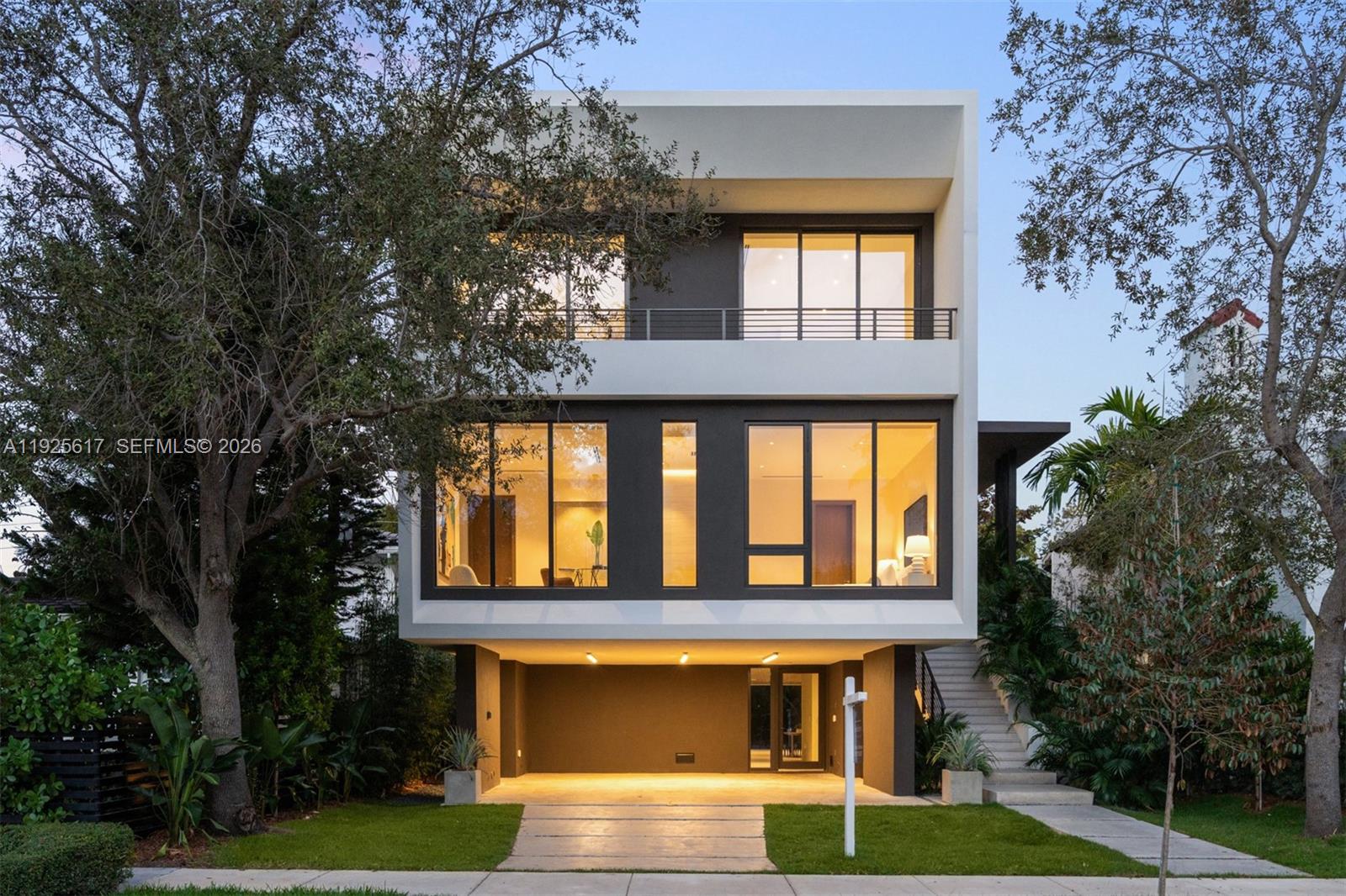 Experience elevated luxury in this exceptional Coconut Grove residence, where open-concept interiors, bespoke built-ins, and refined finishes define effortless sophistication. This 5BR/5.5BA home features a gracious family room and private elevator, crafted with timeless elegance. The first-floor summer kitchen enhances seamless indoor-outdoor living, while the spectacular rooftop terrace offers sweeping bay views and the option to add a private jacuzzi, perfect for serene relaxation or stylish entertaining. The primary suite exudes boutique-style comfort with a tranquil terrace and expansive walk-in closets.