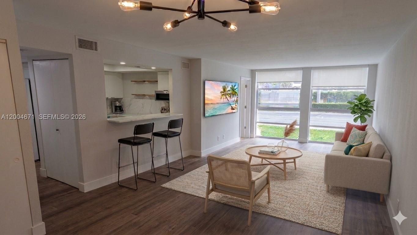 Best value renovated 2 bedroom, 1.5 bathroom condo in Three Islands offering 924 sqft of modern, move in ready living. Features a bright open layout with updated kitchen, new appliances, cabinetry, flooring, and clean contemporary finishes throughout. Convenient first floor access.

Low HOA and fast 1 to 2 week approval make this an easy purchase for both end users and investors. Rental friendly with flexible leasing and seller financing available with 20 percent down, 8 percent interest, 30 year amortization and 5 year balloon.

The building has completed its 50 year inspection with special assessment paid in full. Recent community upgrades include renovated elevators, new carpets, baseboards, paint, and refreshed common areas with full structural recertification.

Prime location just minutes from the beach, parks, shopping, dining, and major roads. Well maintained community. Vacant and easy to show.