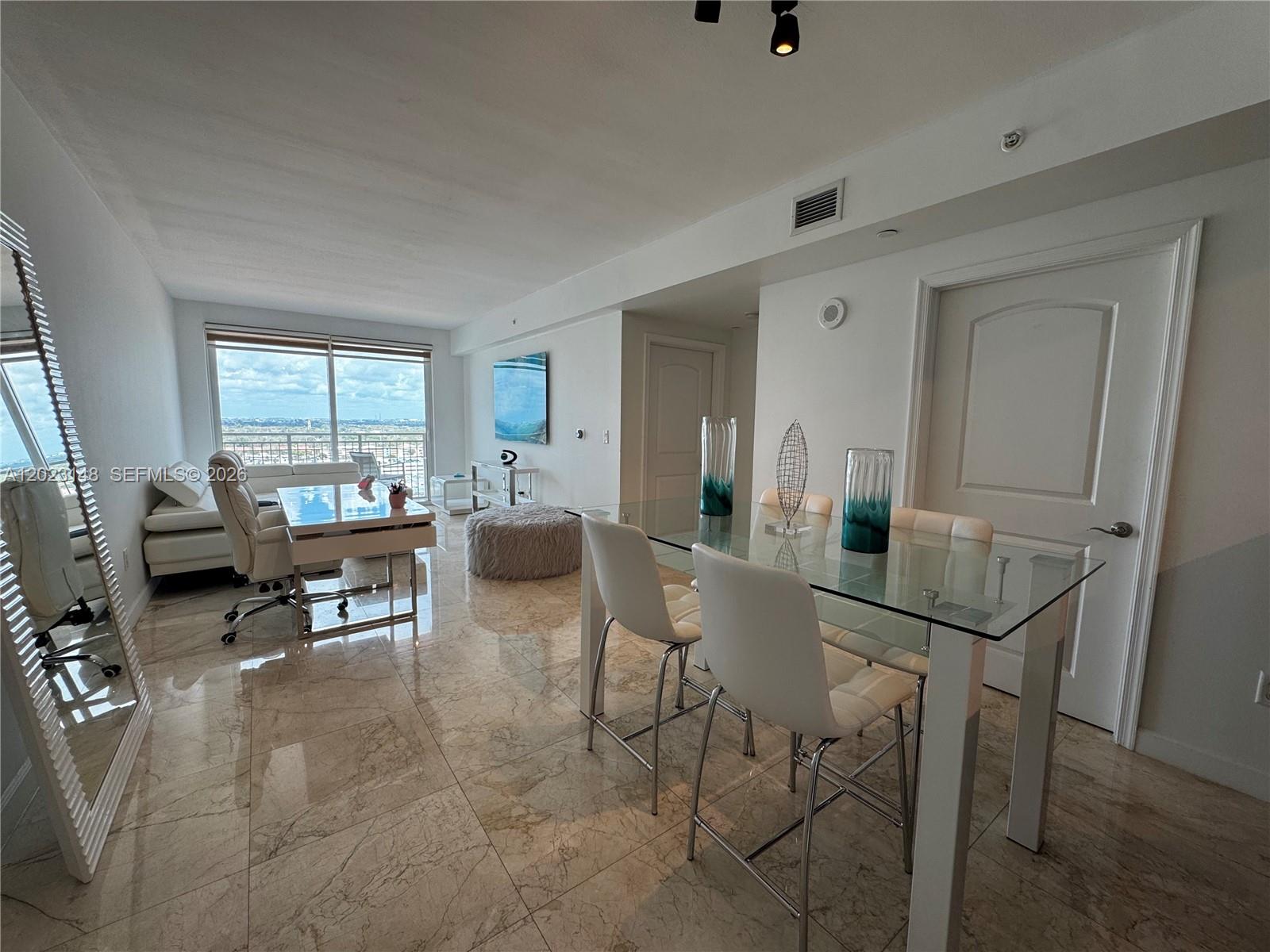 Experience the vibrant lifestyle of Downtown Dadeland, just a short stroll from your door. This stunning condo boasts breathtaking views of Miami and an impressive array of amenities. Inside, you’ll find elegant flooring, modern LG appliances, and custom blackout shades. The primary bedroom features a built-in closet and a balcony, perfect for morning coffee or evening sunsets. The community offers a grand lobby with concierge services, a residents' club room with billiards, and a peaceful meditation garden. Additional amenities include electronic garage access, 24-hour monitoring, and complimentary valet parking. HOA includes: basic cable, internet, water and sewer, and one covered parking space.

Select furnishings may also be available for purchase separately, offering a convenient move-in opportunity for buyers seeking a fully styled living experience.