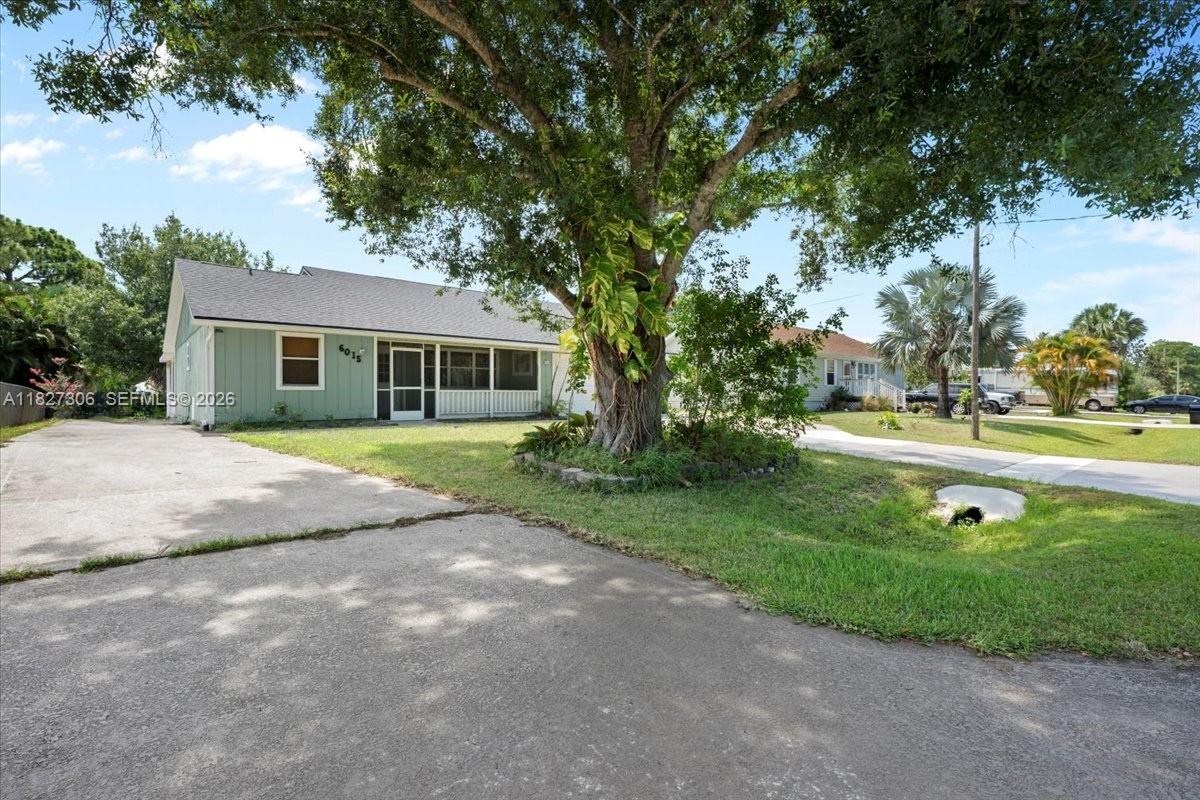 Discover this beautifully renovated 3-bedroom, 2-bathroom home with a spacious 2-car garage, perfectly situated in the highly desirable Indian River Estates community. Featuring a 5- YEAR OLD ROOF, this property combines comfort and peace of mind. Inside, you'll find an inviting open floor plan that includes a generous den/flex space—ideal for a home office, playroom, or additional living area. Enjoy peaceful mornings on the charming screened-in front porch, the perfect spot to relax with your coffee and watch the sunrise. The large backyard is a true highlight, offering ample space for gatherings, grilling, or simply unwinding under the evening sky. With modern updates, flexible living space, and a prime location, this home checks all the boxes—schedule your showing today!