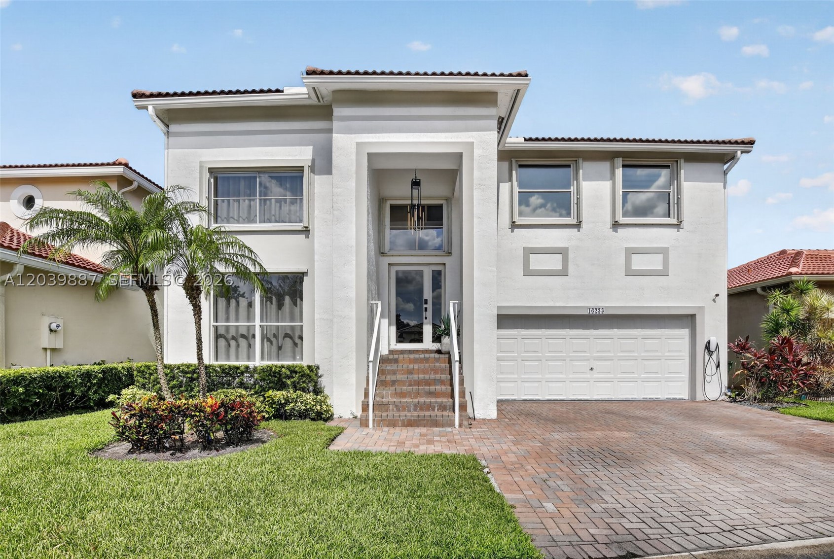 Welcome to this stunning lakefront residence in one of Weston's most desirable communities. This beautifully appointed 4-bedroom, 3-bathroom home offers the perfect blend of luxury, comfort, and modern design. Filled with natural light, the open floor plan showcases beautiful water views, soaring ceilings, and a dramatic glass staircase that serves as a striking architectural centerpiece.

Designed with exceptional attention to detail, the home features custom Italian kitchen cabinetry, elegant Cambria countertops, high-end appliances, custom doors imported from Italy, and exquisite draperies from Spain. Modern Forms light fixtures add sophistication throughout, while the interior design by Andrea Añez creates a seamless balance of style and functionality. A spacious 2-car garage adds convenience.

Weston is known for its beautifully maintained neighborhoods, top-rated schools, parks, golf courses, and exceptional quality of life. Residents enjoy convenient access to shopping, dining, fitness centers, and outdoor recreation. Located between Miami and Fort Lauderdale, Weston offers easy access to major business centers, international airports, beaches, and entertainment while maintaining a peaceful residential atmosphere.

Whether enjoying lake views from your backyard or entertaining guests in bright open living spaces, this exceptional home delivers the South Florida lifestyle in one of the region's most sought-after cities.