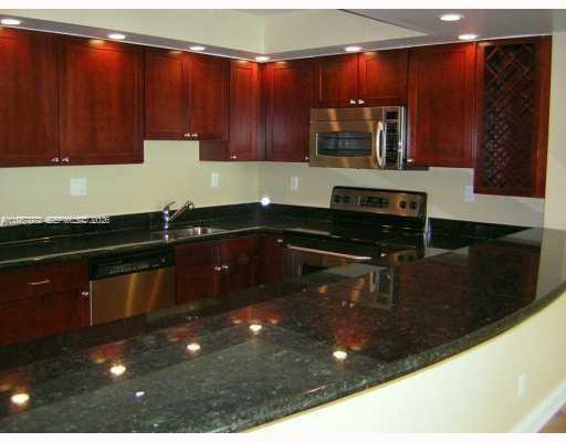 Beautiful unit in Sunny Isles Beach featuring  stunning ocean and bay view. Locateds on the 12 floor, this unit offers an open balcony , a modern kitchen with granite countertops, and wood floring on the living room area . Enyoy large walk -in closets and a spacious layout. Just steps from the beach and minutes from Aventuta mall.