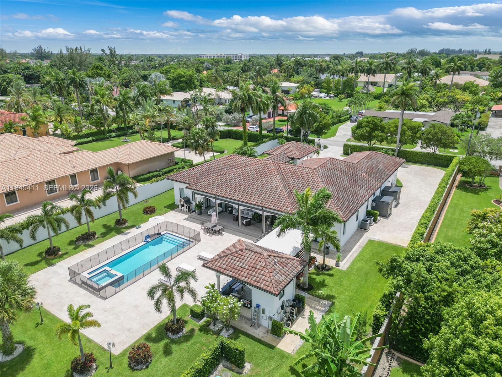 Discover the perfect blend of luxury, privacy, and meticulous craftsmanship in this 6 bed, 6 bath, 38,000 + dqf lot size home.  Over 5,000 sq. ft. of elegant travertine pavers expand the driveway and seamlessly connect to a beautifully designed backyard. Lush Podocarpus hedges span 300+ linear feet along the property line, ensuring total privacy, while more than 100 custom landscape lights illuminate the exterior with warmth and sophistication. Step inside to find upgraded designer light fixtures throughout, a fully air-conditioned and remodeled garage, and dramatic new front doors that set the tone for the entire home. The concrete perimeter wall has been freshly painted, and both the interior and exterior boast a crisp, modern finish. Right next to top private school Belen Jusuit.