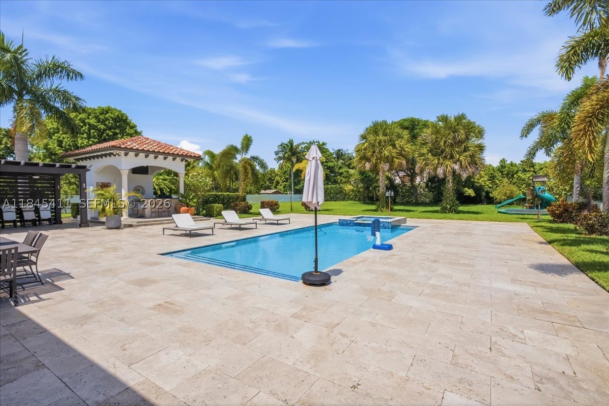 Discover the perfect blend of luxury, privacy, and meticulous craftsmanship in this 6 bed, 6 bath, 38,000 + dqf lot size home.  Over 5,000 sq. ft. of elegant travertine pavers expand the driveway and seamlessly connect to a beautifully designed backyard. Lush Podocarpus hedges span 300+ linear feet along the property line, ensuring total privacy, while more than 100 custom landscape lights illuminate the exterior with warmth and sophistication. Step inside to find upgraded designer light fixtures throughout, a fully air-conditioned and remodeled garage, and dramatic new front doors that set the tone for the entire home. The concrete perimeter wall has been freshly painted, and both the interior and exterior boast a crisp, modern finish. Right next to top private school Belen Jusuit.