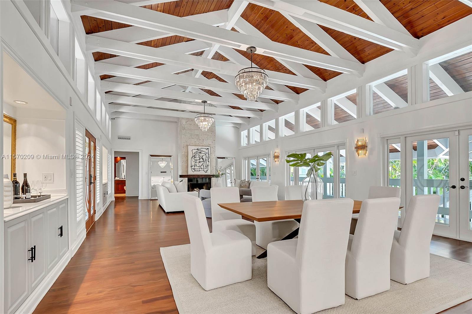 Nestled on a generous 15,000 sq.ft lot on a quiet cul-de-sac within the prestigious guard-gated community of Entrada Estates in Coconut Grove, 3620 Curtis offers a serene retreat. This iconic 4-bedroom, 4.5-bathroom home spans 4,115 square feet of living area, exuding Key West charm with wraparound porches, louvered shutters, and lush greenery. With a newly renovated chef's kitchen, a luxurious master bath, and vaulted ceilings with impact windows, the home is flooded with natural light. The property features a pet spa, 2 car garage, a spacious loggia for entertaining, a sparkling heated pool, and a turfed yard - perfect for gatherings. Conveniently located near Coconut Grove's finest amenities and top-rated schools, this home is an entertainer's paradise and a sanctuary for modern living.