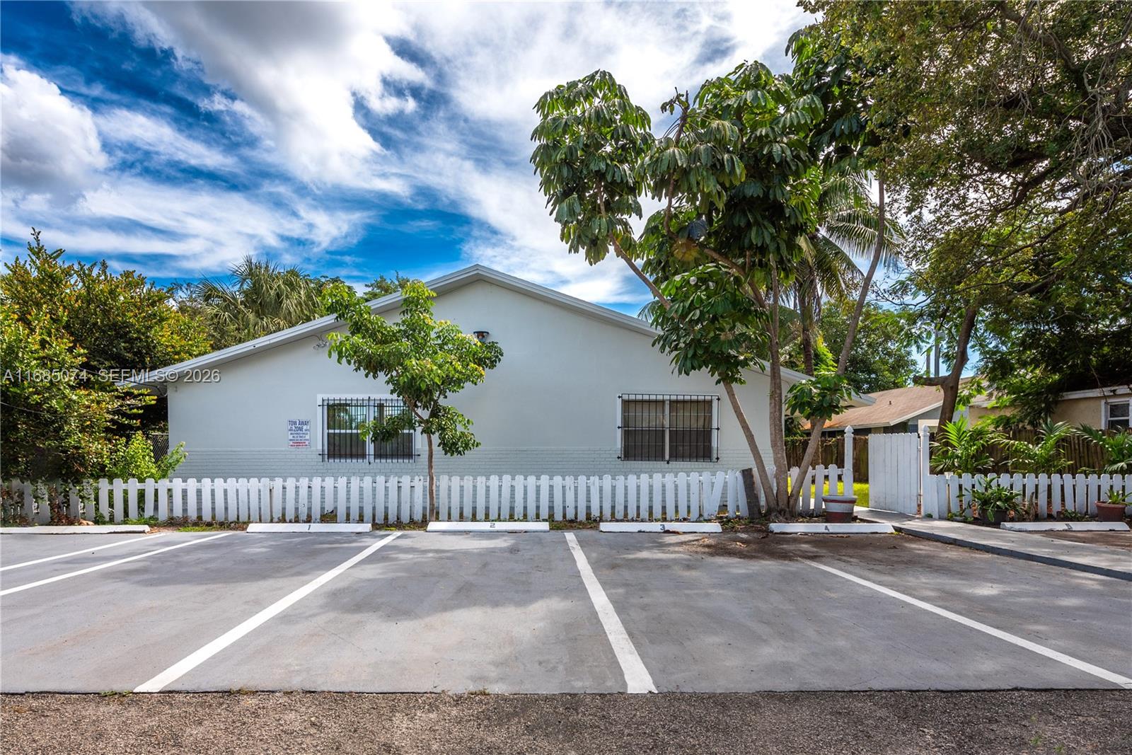 If you're looking for a fantastic investment opportunity in a prime location, this property is for you! Presenting a well-maintained building with 5 legal units located in the sought-after Lake Ridge area of Fort Lauderdale. Rental Income:3 one-bedroom units rented at $1,800/m, 2 two-bedroom units rented at $2,400/m. All units currently leased on one-year leases. Recently replaced Roof in 2020. 40-Year Certification Passed and up-to-date. 6 electric meters and 1 water meter. Coin-operated washer and dryer. Each apartment has designated private parking. Perfectly situated just minutes away from Las Olas Blvd, Victoria Park, and Flagler Village. Proximity to numerous shopping, dining, and entertainment options, making it attractive to potential tenants.