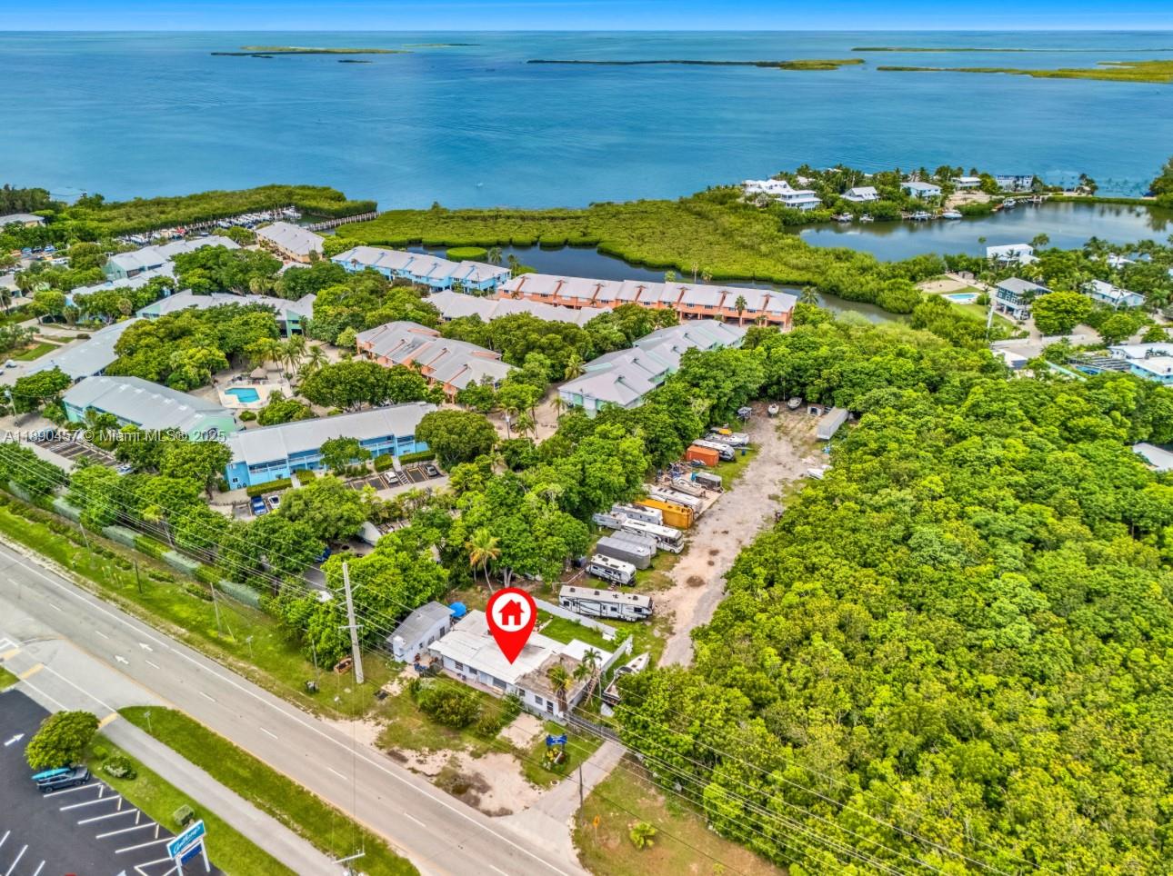 INCREDIBLE OPPORTUNITY! 
125 feet of Road frontage on Overseas Highway 
Storage Yard Facility with Marina License located on the Bay Side 
Property has many improvements including office building and living space with additional separate cottage
Don't miss out on this amazing opportunity 
CALL L/A for showings and details 
Do not visit the property without an appointment