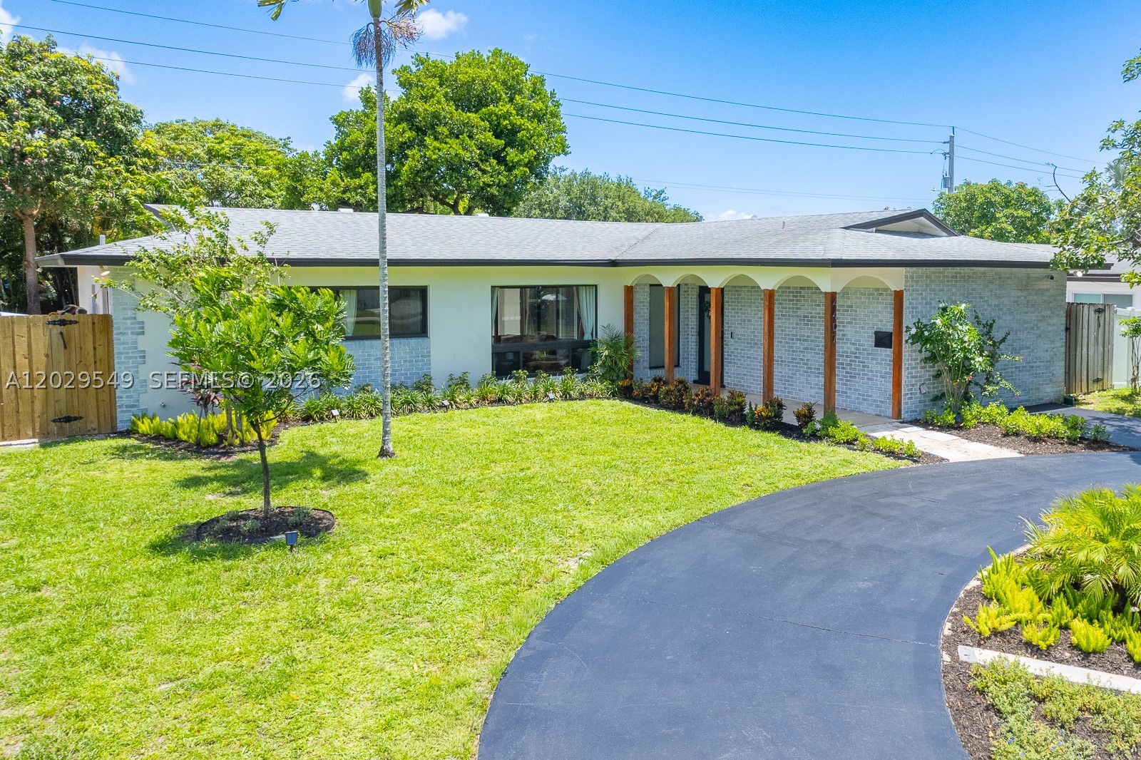 Completely renovated Hollywood Hills pool home where virtually every major system and finish has been upgraded. Featuring a 2020 roof, impact windows and doors, updated electrical system, PVC sewer and water lines, insulation, ductwork, tankless water heater, remodeled kitchen and baths, and a newer A/C (2020), this home offers true peace of mind. The bright open-concept design is enhanced by wood-look ceramic tile, recessed lighting, oversized impact sliding doors, and pool and garden views from nearly every room. At the heart of the home is a stunning chef's kitchen with white shaker cabinetry, quartz countertops, copper hardware, stainless-steel GE appliances, wall oven, and designer lighting. The resort-style backyard is built for entertaining with a resurfaced Diamond Brite pool (2026), expansive covered patio, privacy fence, kiddie pool fence, kiddie basketball court, new landscaping, irrigation system, and gated rear alley access. Additional improvements include exterior paint and re-stucco (2023), fresh interior paint (2025), driveway resurfacing (2026), exterior lighting, and a Vivint security system with cameras. Ideally located near parks, schools, shopping, dining, and major commuter routes. A rare turnkey opportunity combining modern design, quality construction, and the South Florida lifestyle buyers dream about.