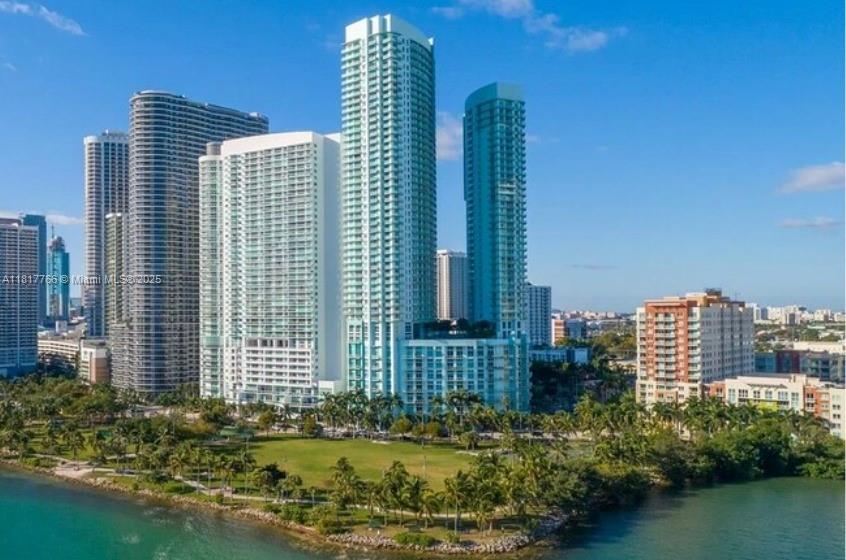 Prime investment in Edgewater. Tenant-occupied with a long-term lease in place, the lease commencing  February 10, 2026. Buter to assume lease- perfect for income-focused buyers  Experience elevated living in this high-floor 1BD/1.5BA at Quantum on the Bay, located in the heart of vibrant Edgewater. This bright and modern residence offers a spacious layout, floor-to-ceiling windows, and a private balcony with partial bay views. Enjoy a sleek open kitchen with stainless steel appliances and in-unit washer/dryer. Assigned covered parking included. Full-service building with 24/7 security, concierge, two pools, gym, party room, theater, and more. Just steps from Margaret Pace Park, Publix, restaurants, and minutes to Wynwood, Brickell, and Design District. Perfect for end-users or investors—rent 2x/year, min 6 months. Live the Miami lifestyle in one of the city’s most desirable waterfront towers.