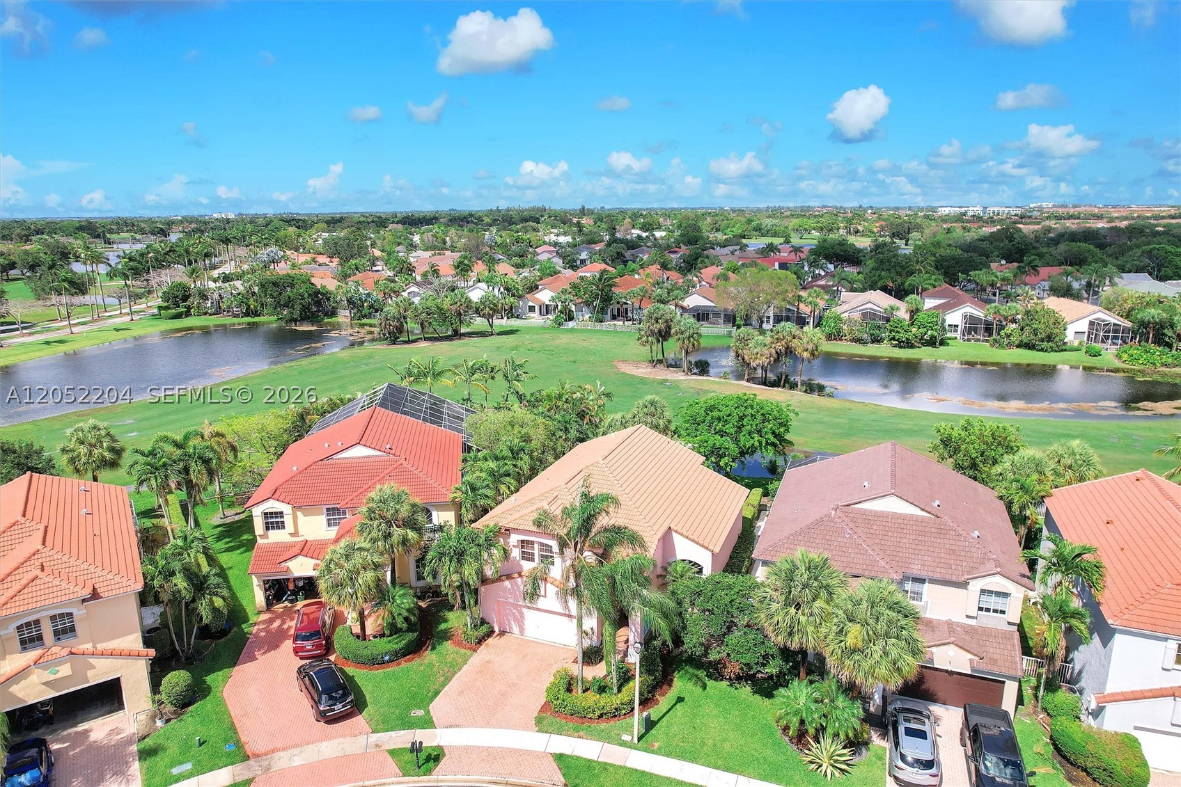 Great 4 BR plus loft, 3 Bath, 2 car garage home right on the 4th fairway of the Royal Course at Grand Palms Golf Resort Community. Stainless steel appliances, pantry, eat-in kitchen. Impact windows & doors, 2008 roof, new laminate flooring in living and dining room, new carpet upstairs, remodeled guest bath, A/C only 2 years old. Double sliding glass doors open to a big backyard. Lawn service, internet, cable, alarm & manned gate security, tot lot, incl in HOA dues. Planned $1 billion dollar re-development of Grand Palms common areas is working through final approvals. Will not cost home owners anything via any planned special assessment as Grand Palms common areas are still owned by original developer/successors - but will tremendously increase all community home values when completed.Great location for golf, fitness center, new shopping, and dining. Good schools, close to I-75 for easy commute in every direction.