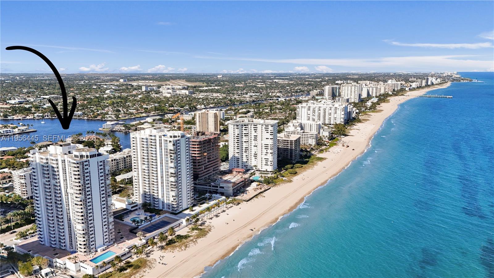 Step into this exquisite 2 bedroom, 2 bath beachfront residence offering 1,630 sq ft of living space and panoramic ocean views that greet you from the moment you enter. Floor-to-ceiling impact glass windows flood the home with natural light while providing peace of mind and effortless indoor-outdoor living. The expansive open living and dining area flows seamlessly onto an oversized private balcony, perfect for enjoying sunrise coffees, sea breezes, or evening relaxation with ocean vistas as your backdrop. Retreat to the spacious primary suite, complete with a large walk-in closet and a beautifully updated marble-accented ensuite bathroom. The second bedroom, also showcasing ocean views, can double as an impressive home office or guest suite. Throughout the unit, you'll find tile and woodgrain laminate flooring and thoughtful design touches that elevate the living experience. An additional separate storage unit is included. Resort-style amenities: heated pool, spa, tennis, pickleball, sauna, fitness center, covered parking, BBQ area, and a spectacular Sky Lounge with panoramic views and kitchen/entertainment space. Building features impact glass, secure entry, and well-maintained common areas. Prime oceanfront location with direct ocean access!