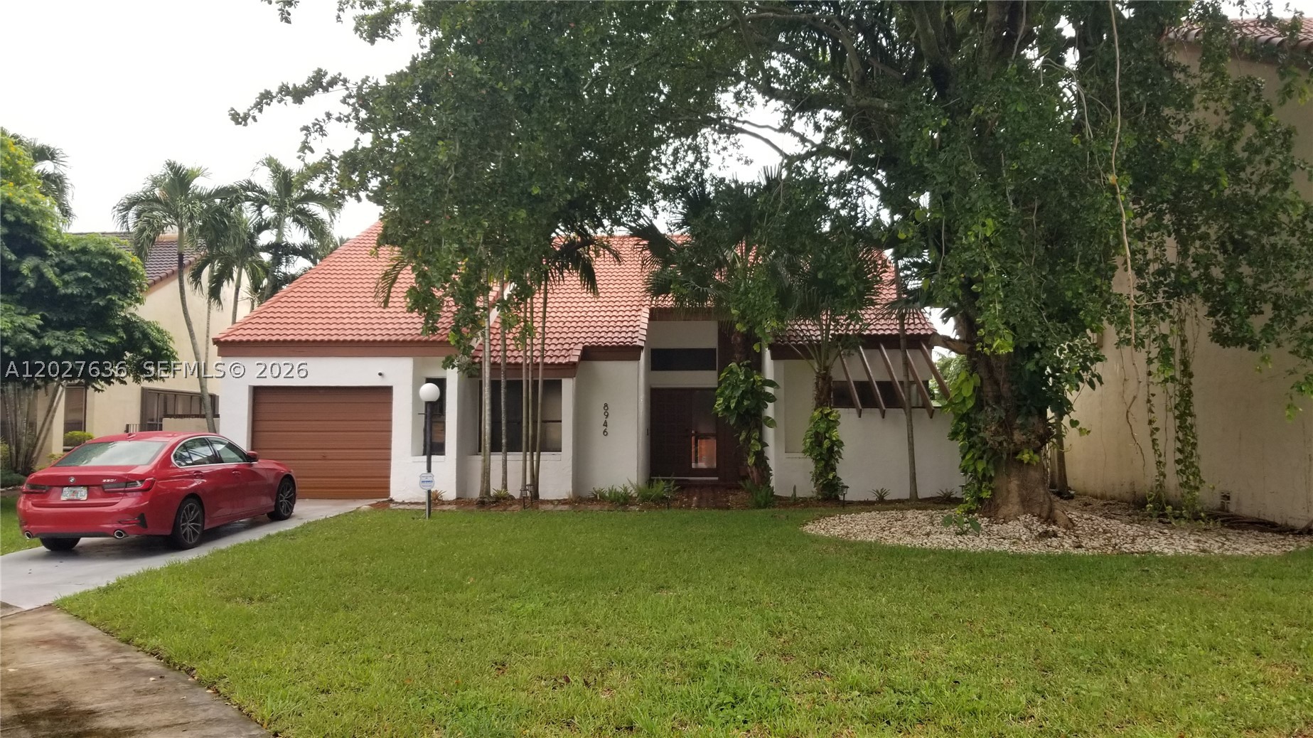 Beautiful 2-story detached home in desirable Hammocks Sec. 1 featuring 3 bedrooms, 2 baths, 2,063 SF of living area, a 1-car garage, and a fenced 6,789 SF yard. Major recent updates include a 2024 tile roof, 2024 impact windows and doors, 2024 water heater, 2024 refrigerator, 2024 garage door and opener, 2024 washer, laminate flooring throughout, automatic blinds installed in the master bedroom and 2023 exterior A/C compressor. Enjoy bright, open living spaces, a modern kitchen, a spacious family room with a working fireplace, updated baths, a spacious primary bedroom, and a private backyard ideal for relaxing or entertaining. Seller reports NOT in a Flood Zone. Existing VA loan at 5.375% may be assumable by a qualified buyer, subject to lender/servicer/VA approval and all assumption requirements. Roof PACE loan to be paid off at closing. 3rd bedroom on the second floor off a spiral staircase.  Note that the current American Home Shield home warranty is transferable to the new buyer at closing.