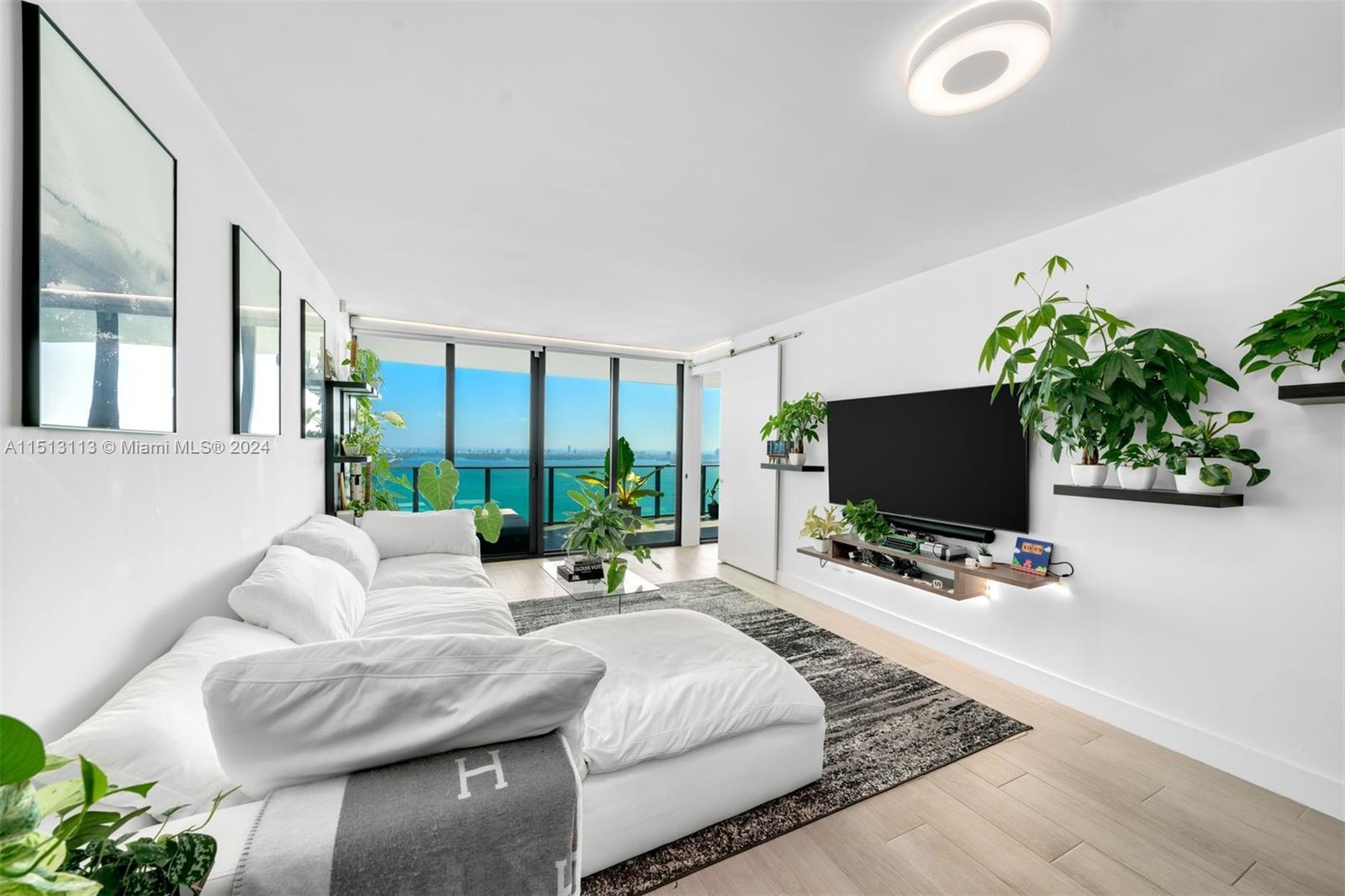 A beautifully finished 3 Bed+Den/3.5 Bath flow-through residence at One Paraiso w/ 1,526 int sq ft + 2 balconies totaling 354 sq ft. Features include porcelain tiled flooring throughout, built-in closets in all bedrooms, motorized shades, recessed lighting w/ Phillips hues bulbs, new AC unit (installed Jun 2021), new washer & dryer, NEST thermostat, and smart door lock. Breathtaking views of Biscayne Bay, Atlantic Ocean, and Miami Beach skyline from 41st floor. Amenities include a state-of-the-art fitness center, 3 pools, hot tub, BBQ, lighted tennis courts, business center, theater, children's playroom, full-service concierge, and more. Within walking distance of the upcoming Whole Food Market and short drive to the shops, restaurants, and entertainment in Wynwood & Miami Design District.