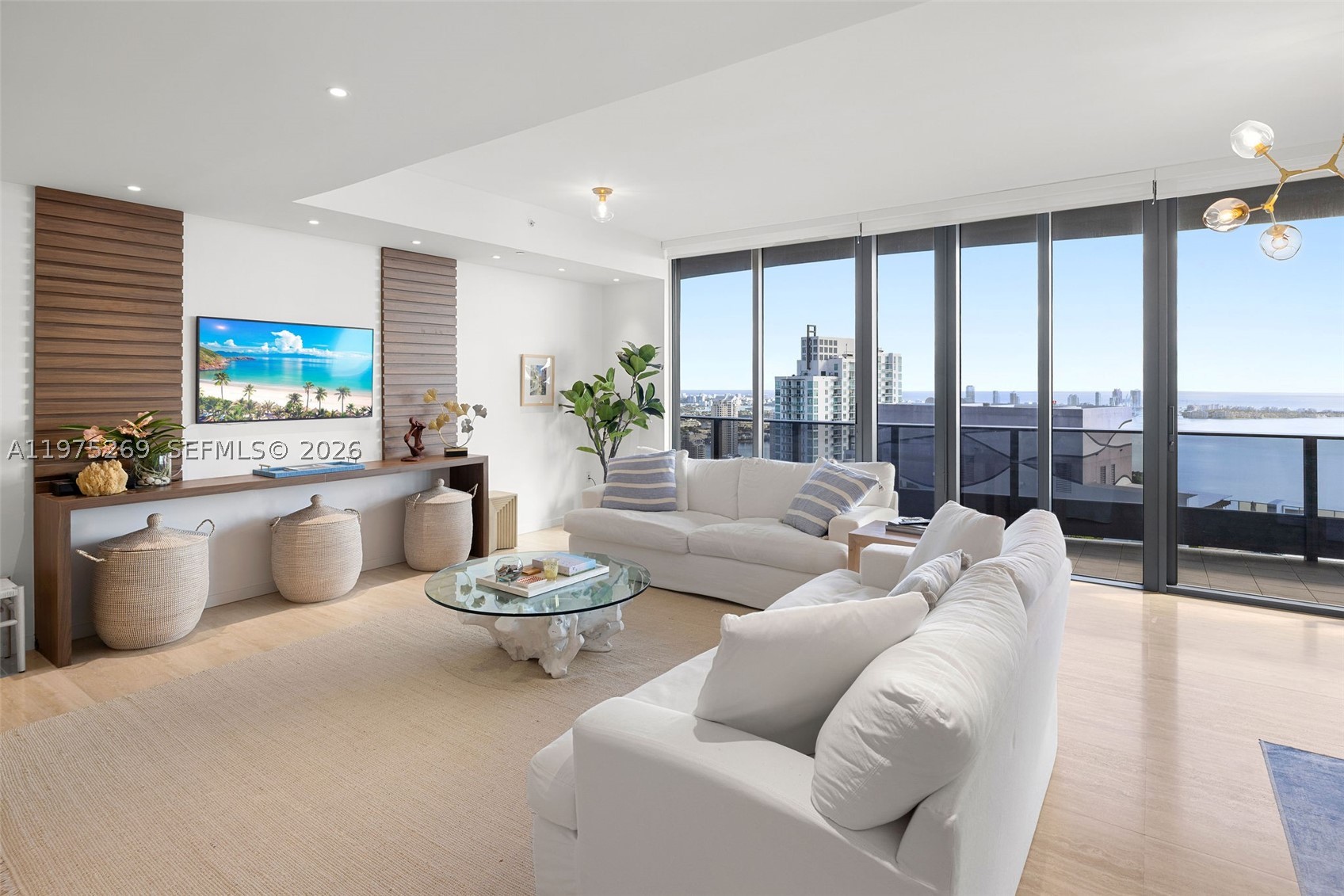 Enjoy luxury living in this spacious 3 bed + den / 3.5 bath penthouse on the 54th floor of Brickell Flatiron. This penthouse offers privacy & sweeping views of the Miami Skyline, Biscayne Bay and the Atlantic Ocean.  Features: 10-foot high floor-to-ceiling glass windows, travertine flooring, Snaidero kitchen cabinets, Miele appliances, electric shades, two entries and a full length balcony accessible from each room. The 64th floor rooftop amenities include a resort style pool area, oversized fitness center with pilates/yoga room and a private spa/relaxation area. Add'l amenities include a club room, a lap pool, movie theater, children's playroom, lounge & billiards room. 24 hour valet, concierge, doorman and security. Located next to Mary Brickell Village & Brickell City Center. Three parking spaces included. Available furnished/unfurnished.