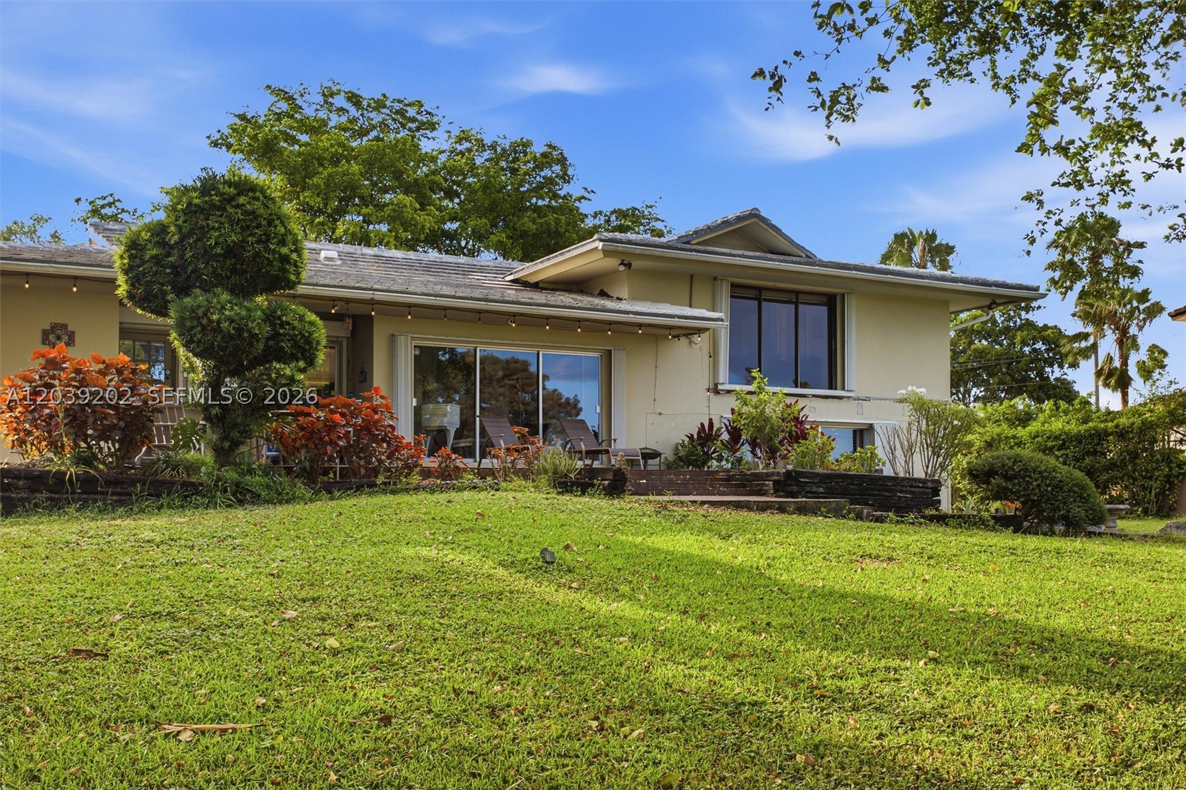 SWEAT EQUITY AWAITS – This charming home sits on a beautiful lot in the sought-after Country Club of Miami Estates. With 2,725 square feet of living space, 3 beds, 3 baths, and an office, there's an opportunity to update and design the home you've always wanted. Yes, this property offers classic Miami character—make it your dream home or investment property. That's exactly why it's priced correctly and offers incredible possibilities in a market projected for continued appreciation. Spanning three levels, the layout provides distinct living, entertaining, and private retreat spaces, with views that invite you to relax and unwind any moment of the day. Bring your imagination and a vision for transforming this jewel into a masterpiece. Location is everything, and this address delivers. Country Club of Miami Estates offers a lifestyle that rivals Coral Gables' prestigious golf communities, and Miami Lakes itself is seeing strong price appreciation. You're buying the location, the space, and the opportunity to build equity in a home you will love.