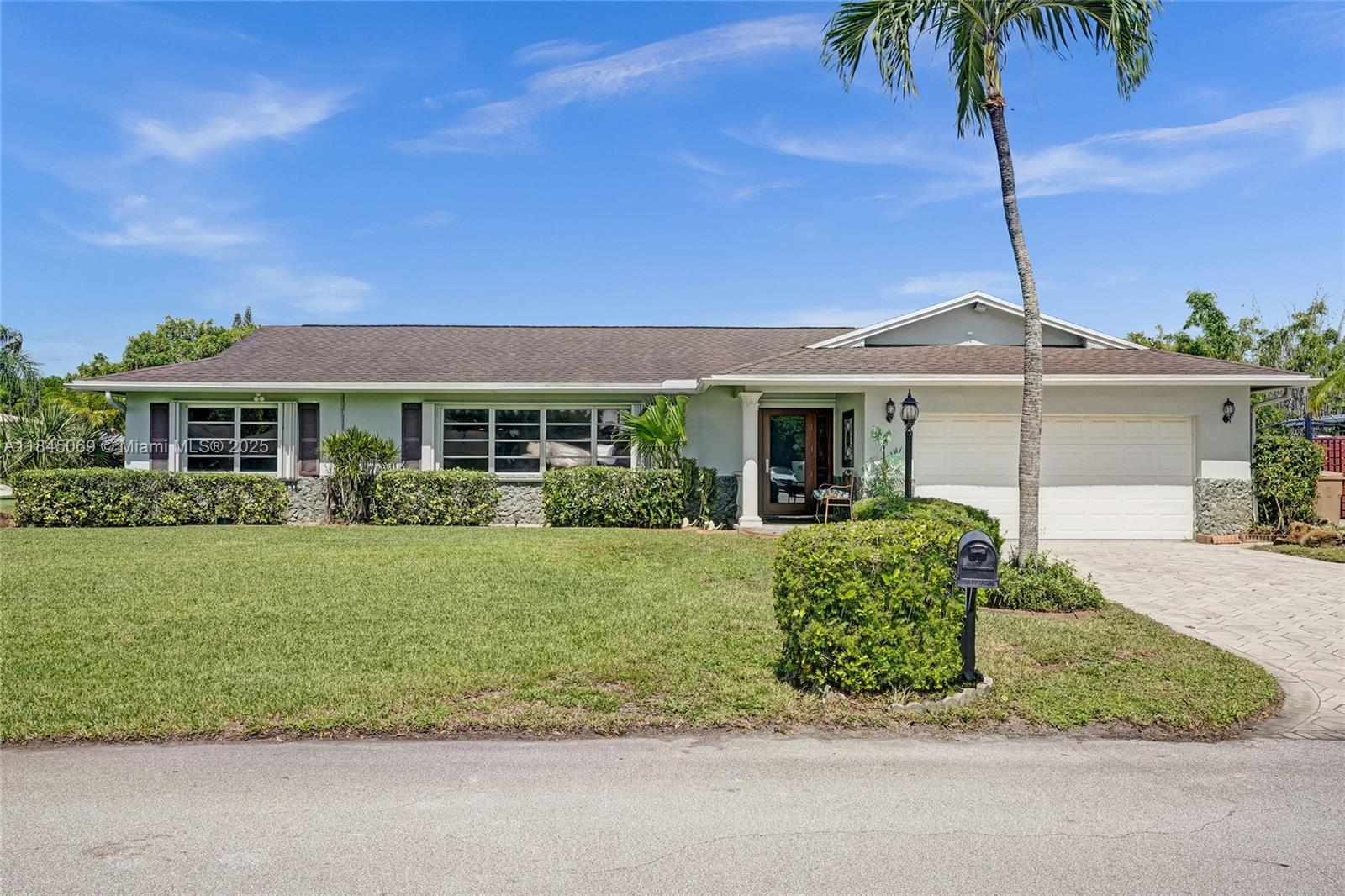 This magnificent  pool home boasts 3 spacious bedrooms, 2 full baths, and a convenient 2-car garage, all within a comfortable 2,426 sqft of living space. Situated on a large corner lot just over a quarter acre, this property truly stands out with its unparalleled capacity for all your recreational vehicles and toys! The extensive pavered driveway offers an abundance of secure parking for your RV, boat, trailer, jet skis, and more! Newer roof and A/C  both installed within the last 5 years. For added security and peace of mind during storm season, the front entry door and cabana bath door are hurricane-rated, complemented by accordion shutters on all remaining windows and doors. Beyond the home's impressive features, you'll love the location in a super quiet and safe neighborhood.