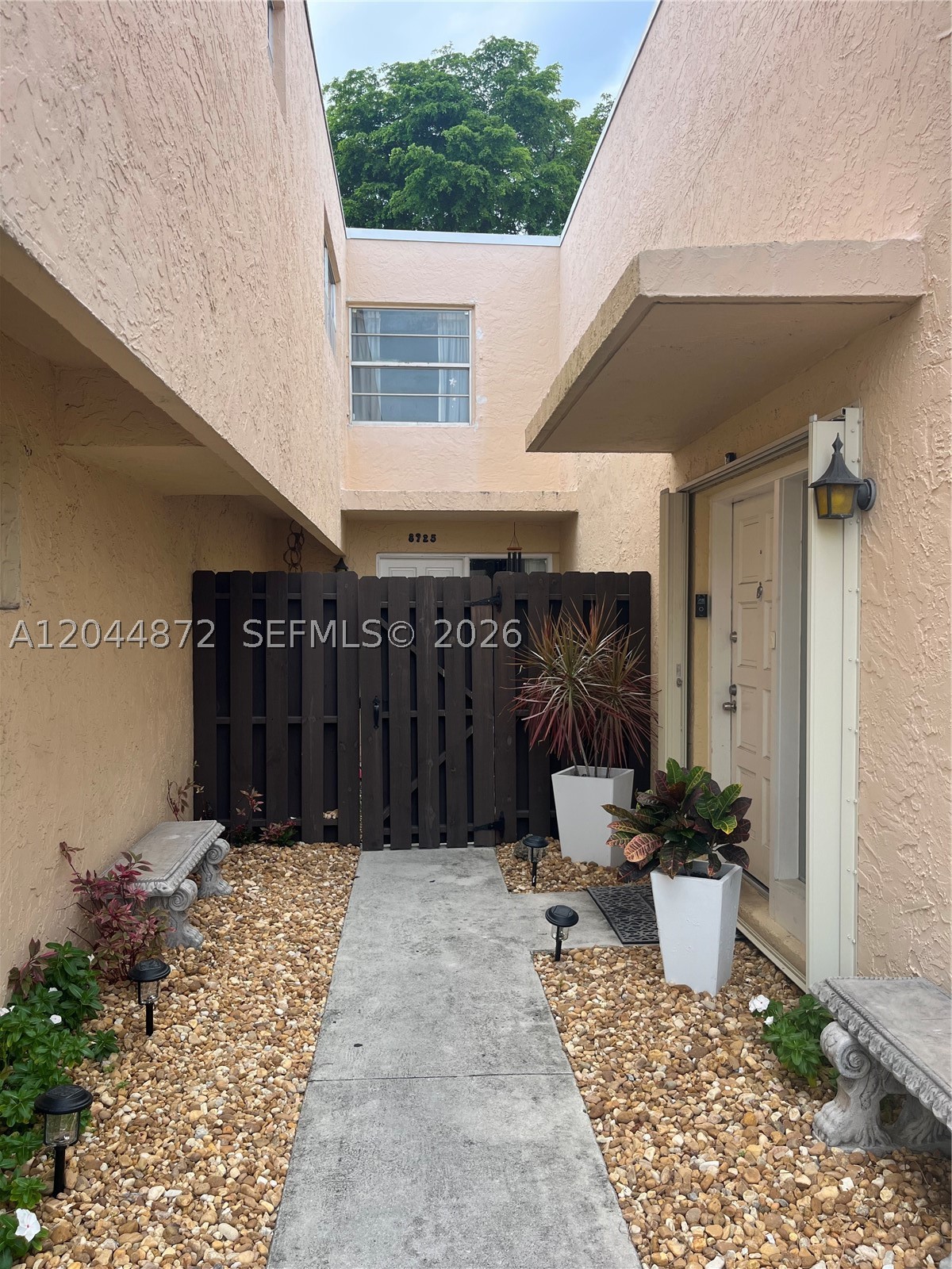 Welcome to this charming 2-bedroom, 1.5-bath townhouse located in the desirable Shores Village community in Miami Shores. This bright and inviting home offers a functional layout with spacious living and dining areas,Step outside to your own beautiful private garden. Ideally located just minutes from shopping, dining, parks, schools, beaches, and major highways, this townhouse combines comfort, convenience, and the best of the Miami Shores lifestyle. A wonderful opportunity for homeowners or investors.