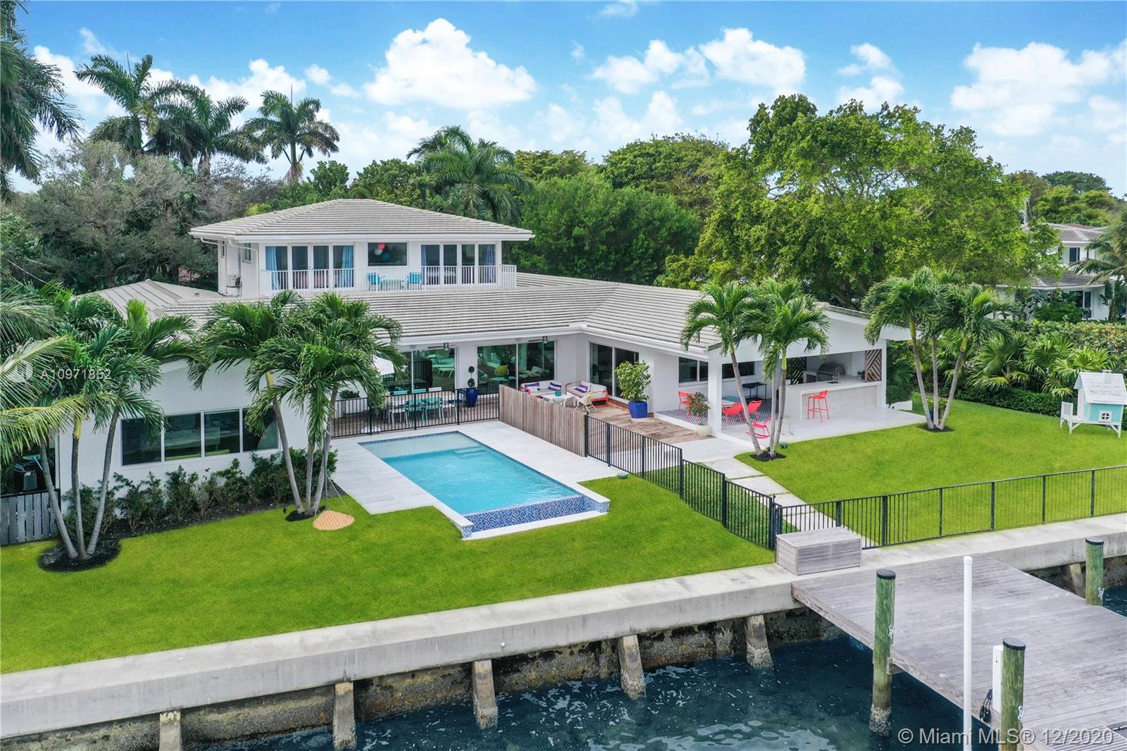 Live in a Spectacular Home right on Biscayne Bay. With more than 100ft of water frontage, this 6000 SqFt home has plenty of space and breathtaking views. Custom built on a 17, 500 SqFt lot the property offers 6 bedrooms, 8 bathrooms, large indoors and outdoor entertaining areas, infinity salt water pool, sauna, bocce court, top of the line appliances, state of the art security system, touch-less home delivery set up, play room and a brand new dock/lift with 30,000 lbs capacity.