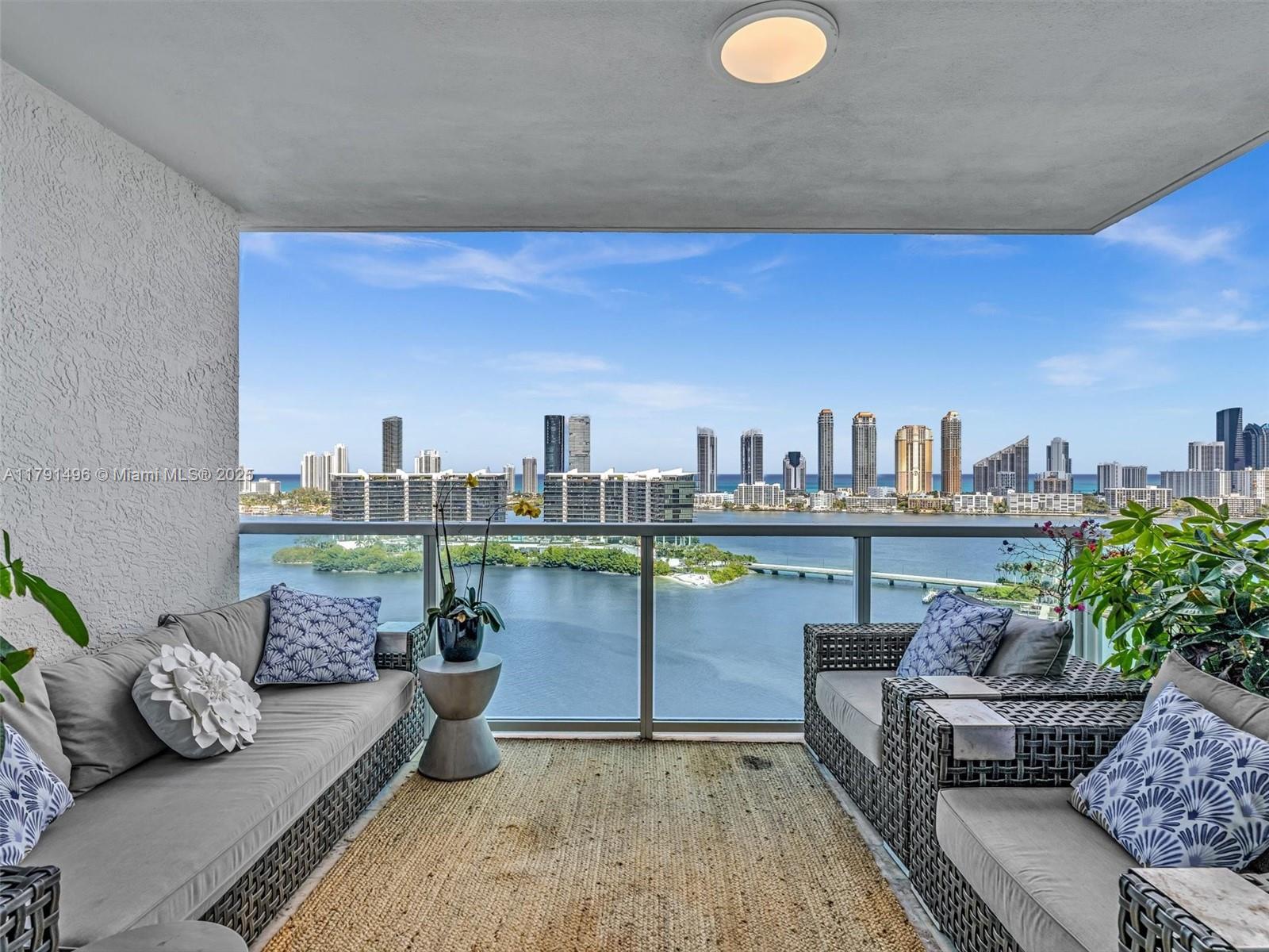 This exceptional residence showcases sweeping views of the ocean from the living areas and stunning sunset vistas from the bedrooms. 3,298 sf of meticulously curated living space, fully remodeled with bespoke touches and top-of-the-line finishes. A private elevator opens to a formal foyer, unveiling 3Bed, 3Bath, and a versatile media room easily convertible to a 4th bedroom. Wide-plank wood flooring flows throughout, complemented by custom walk-in closets and an Italian-designed, spacious, and bright kitchen equipped with premium appliances. Enjoy world-class amenities, including two state-of-the-art fitness centers, two resort-style pools, three tennis courts, a luxurious spa, children’s playroom, social lounge, café, gated entry, 24-hour concierge, valet parking, and private storage.
