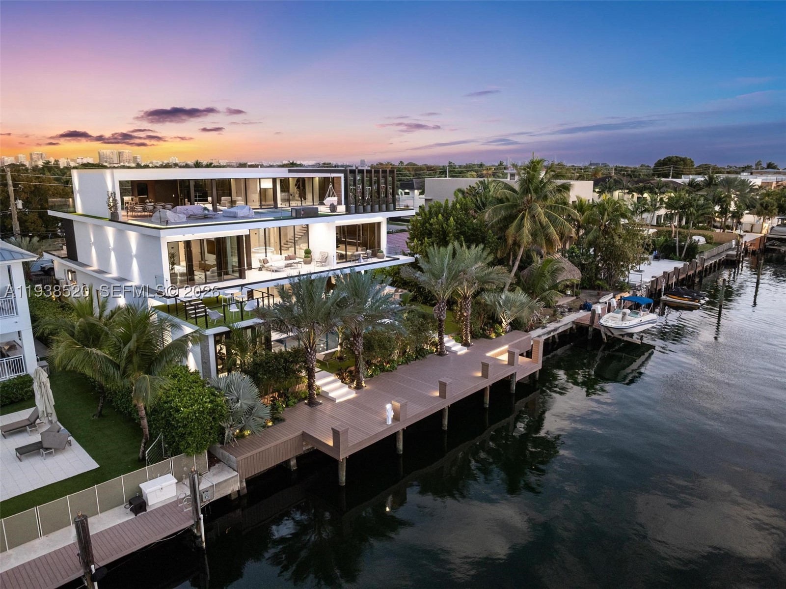 This expansive waterfront residence is located within the gated community of Keystone and offers approximately 6,700 square feet under air and 12,800 square feet total. Featuring 75 feet of direct water frontage with private dock access, the home is designed for both refined living and exceptional entertaining. Highlights include a dramatic double height living room with soaring ceilings, an impressive waterfront lounge terrace with sweeping views, a private putting green, a state of the art private gym, an entertaining game room, an elevator, and a dedicated home office. The residence includes seven luxurious bedrooms and seven full plus one half exquisitely appointed bathrooms. Italian millwork by Mia Cucina and furniture by Artefacto throughout complete this exceptional offering.