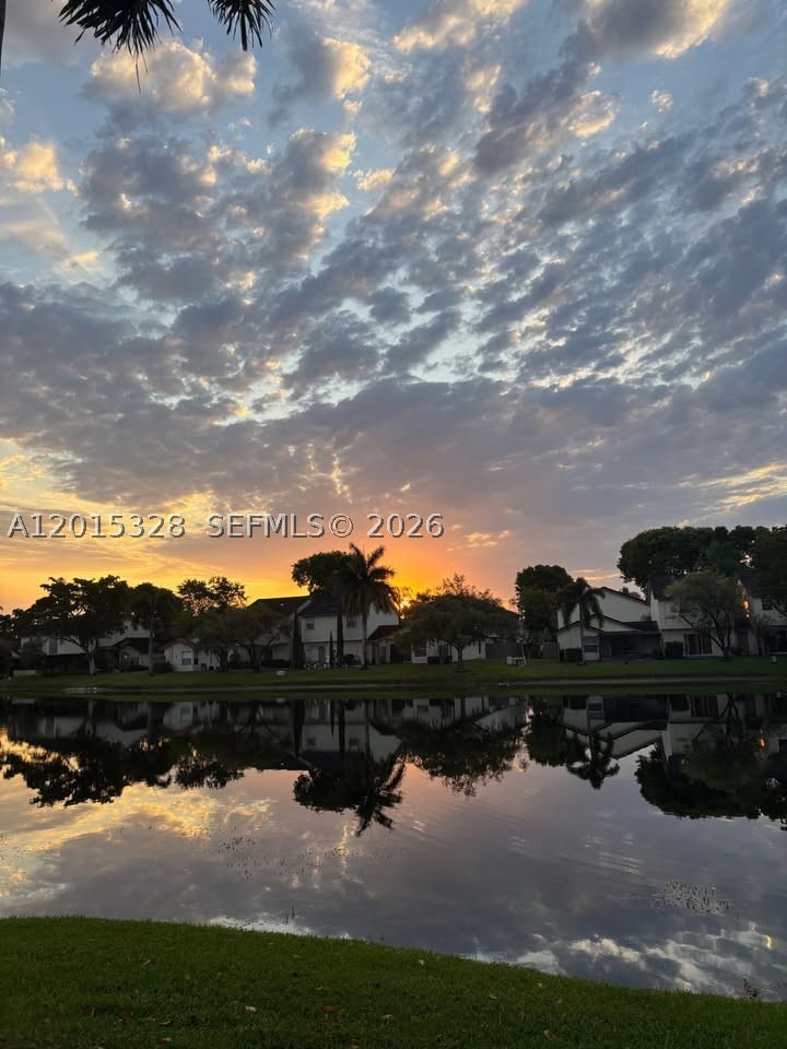 Beautiful 2/2 villa featuring a brand new master bathroom, remodeled guest bathroom, tile flooring throughout, spacious bedrooms, and abundant natural light. Enjoy the peaceful lake view from the large patio and lanai, perfect for relaxing or entertaining. Kitchen includes stainless steel appliances and full-size washer/dryer. Seller offering $10,000 concession toward buyer’s closing costs. Move-in ready! PLEASE NOTE THIS IS A SHORT SALE. SALE IS SUBJECT TO LENDER APPROVAL.