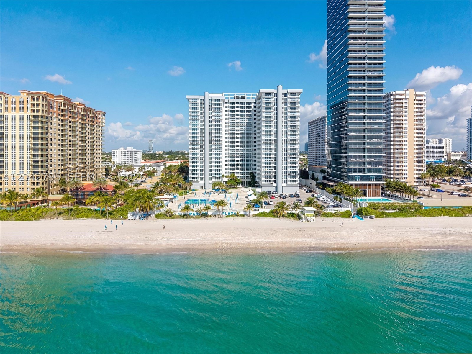 Waterfront 1 bedroom plus den, 1 bathroom residence at Parker Plaza with panoramic ocean views and a large private balcony perfectly oriented to capture the sunrise over the Atlantic. 
Parker Plaza delivers an exceptional amenities : direct beach access with beach service, heated oceanfront pool and spa with BBQ area, Jacuzzi, sauna, steam room, fitness center, billiard and game room, card room, ballroom, and an on-site café restaurant. Monthly maintenance covers Wi-Fi, water, gas, and pest control — only electric paid separately. Building staffing includes 24-hour front desk and valet parking, one assigned parking space and a storage unit. 
Located on South Ocean Drive minutes from Aventura Mall, Bal Harbour Shops, Gulfstream Park, and the dining and entertainment corridor of Hollywood Beach. An outstanding opportunity for a primary residence, seasonal retreat.