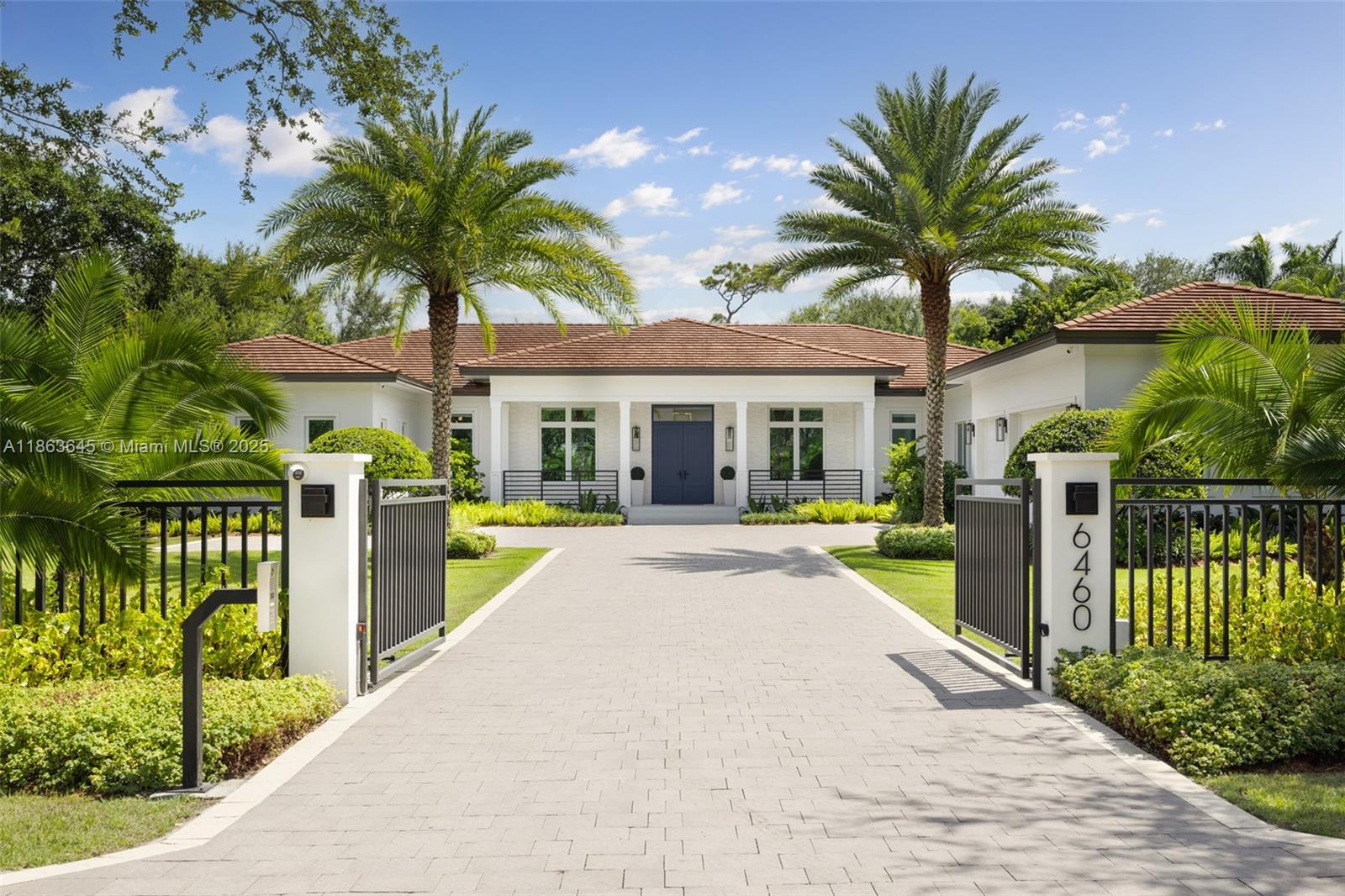 This residence radiates style and quiet luxury. Custom design in collaboration with Hollub Homes, it reflects exceptional craftsmanship, timeless design, and thoughtful livability. On an ultra-quiet street, this home features glass walls with captivating views to a perfectly curated and manicured pool lawn area, sprawling palms, and a Podocarpus hedge that perfectly lines the perimeter.  An open kitchen with dual islands anchors everyday life and entertaining. The bedroom wing keeps the family connected, with a dedicated lounge area for time with friends. The smartly designed professional and wellness wing includes a private office, gym with separate entrance, flex workspace, and laundry room. Every detail was intentional—elevated yet welcoming, from first impression to everyday living.