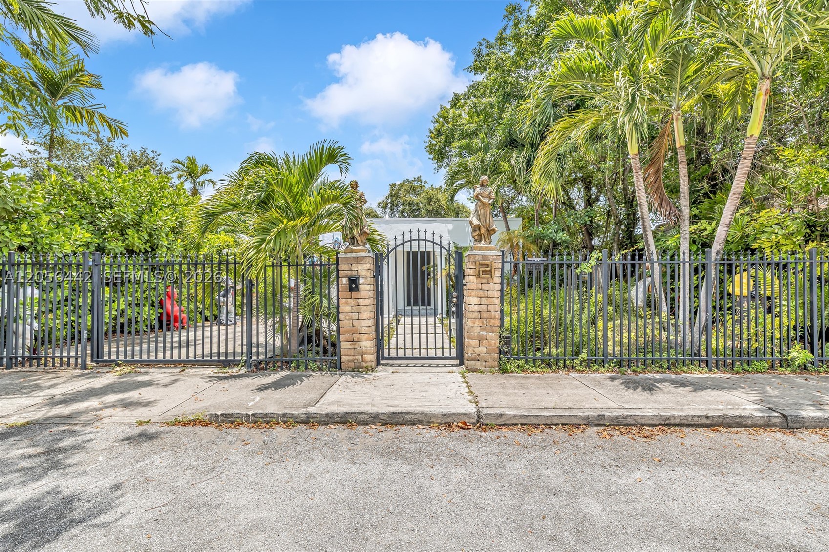 Live in one of the hottest neighborhoods in Miami, minutes to downtown, next to the Design District, Wynwood and Mimo. Mostly renovated home offers new windows, doors, electric, plumbing, bathroom and kitchen with granite counter tops and stainless steel appliances. Travertine flooring throughout. Beautiful backyard offers room to expand the home or create an outdoor oasis. Some minor work is needed to make this perfect - drywall repairs in both bedrooms due to an old roof leak and exterior paint.