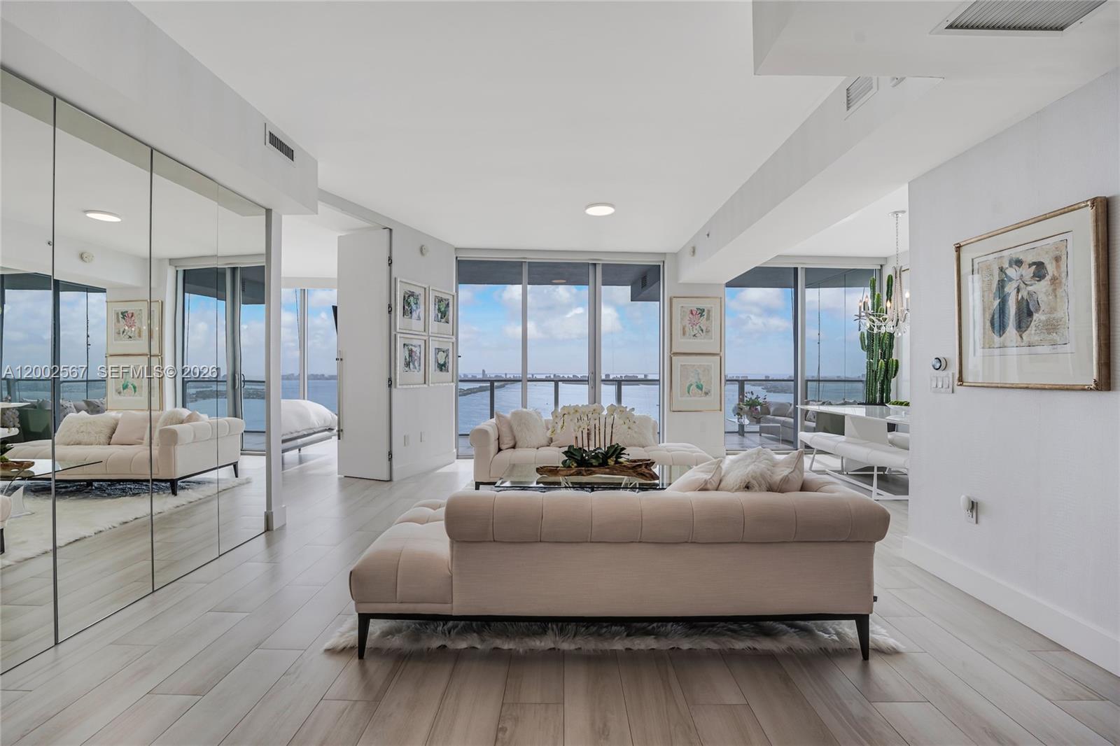 An exceptional residence showcasing intoxicating elegance, where timeless sophistication, impeccable design, and breathtaking views converge. Thoughtfully reimagined with the finest finishes and meticulous attention to detail, this one-of-a-kind home offers sweeping panoramic views of the ocean, Intracoastal Waterway, and Miami Beach skyline.

Perfectly situated in the heart of Miami, the residence is just minutes from the beaches, Miami International Airport, and within walking distance of the Design District, Midtown, and Wynwood's renowned dining, shopping, and entertainment destinations. A brand-new Whole Foods is conveniently located across the street.

Residents enjoy an impressive collection of resort-style amenities, including a private sandy Beach Club with a waterfront pool, cabanas, and volleyball court; a second bayfront pool; tennis, basketball, and pickleball courts; a state-of-the-art fitness center; spa and sauna; business center; club and party rooms; valet parking; 24-hour security; and full concierge services.

The home also includes a six-year warranty on all appliances, including a brand-new washer and dryer. Currently configured as a spacious one-bedroom residence, the home can be easily converted back to a two-bedroom layout, offering flexibility to suit your lifestyle and future needs. Alternatively, an easy addition of a hidden Murphy bed, would barely impact the abundance of storage space, an asset very few condos can claim.