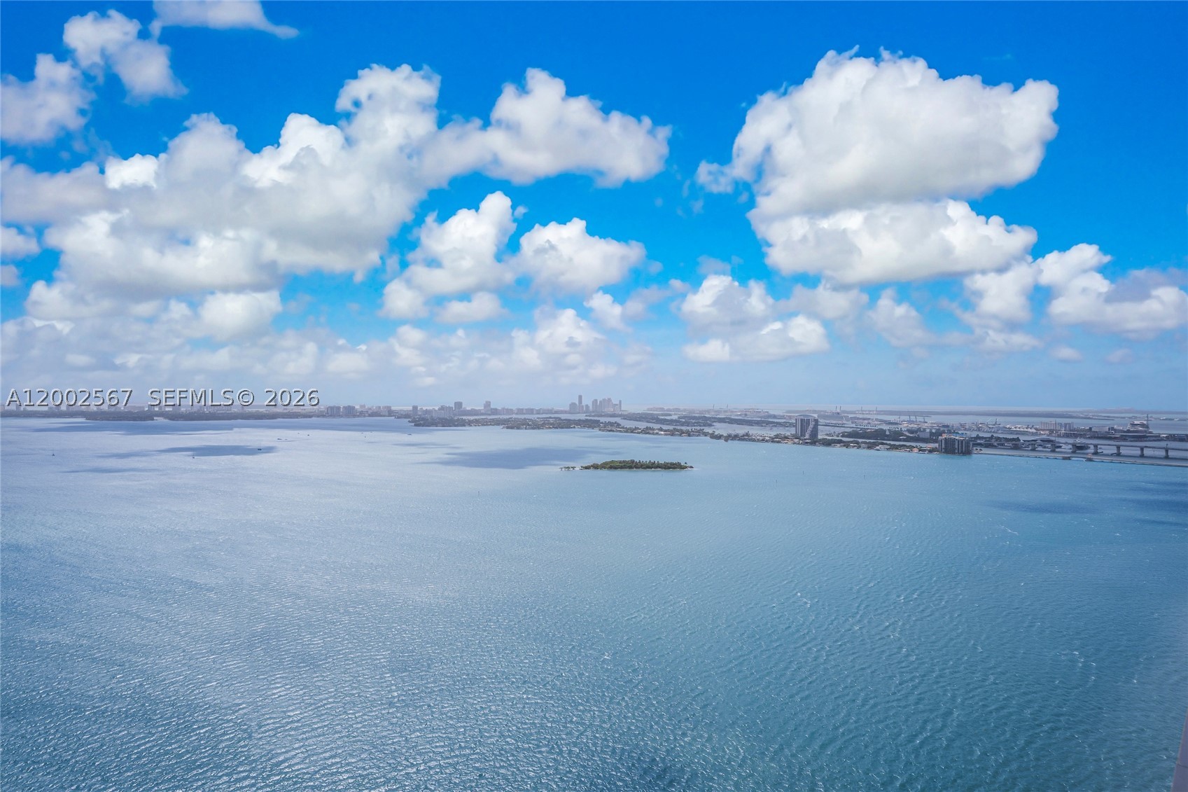 An exceptional residence showcasing intoxicating elegance, where timeless sophistication, impeccable design, and breathtaking views converge. Thoughtfully reimagined with the finest finishes and meticulous attention to detail, this one-of-a-kind home offers sweeping panoramic views of the ocean, Intracoastal Waterway, and Miami Beach skyline.

Perfectly situated in the heart of Miami, the residence is just minutes from the beaches, Miami International Airport, and within walking distance of the Design District, Midtown, and Wynwood's renowned dining, shopping, and entertainment destinations. A brand-new Whole Foods is conveniently located across the street.

Residents enjoy an impressive collection of resort-style amenities, including a private sandy Beach Club with a waterfront pool, cabanas, and volleyball court; a second bayfront pool; tennis, basketball, and pickleball courts; a state-of-the-art fitness center; spa and sauna; business center; club and party rooms; valet parking; 24-hour security; and full concierge services.

The home also includes a six-year warranty on all appliances, including a brand-new washer and dryer. Currently configured as a spacious one-bedroom residence, the home can be easily converted back to a two-bedroom layout, offering flexibility to suit your lifestyle and future needs. Alternatively, an easy addition of a hidden Murphy bed, would barely impact the abundance of storage space, an asset very few condos can claim.
