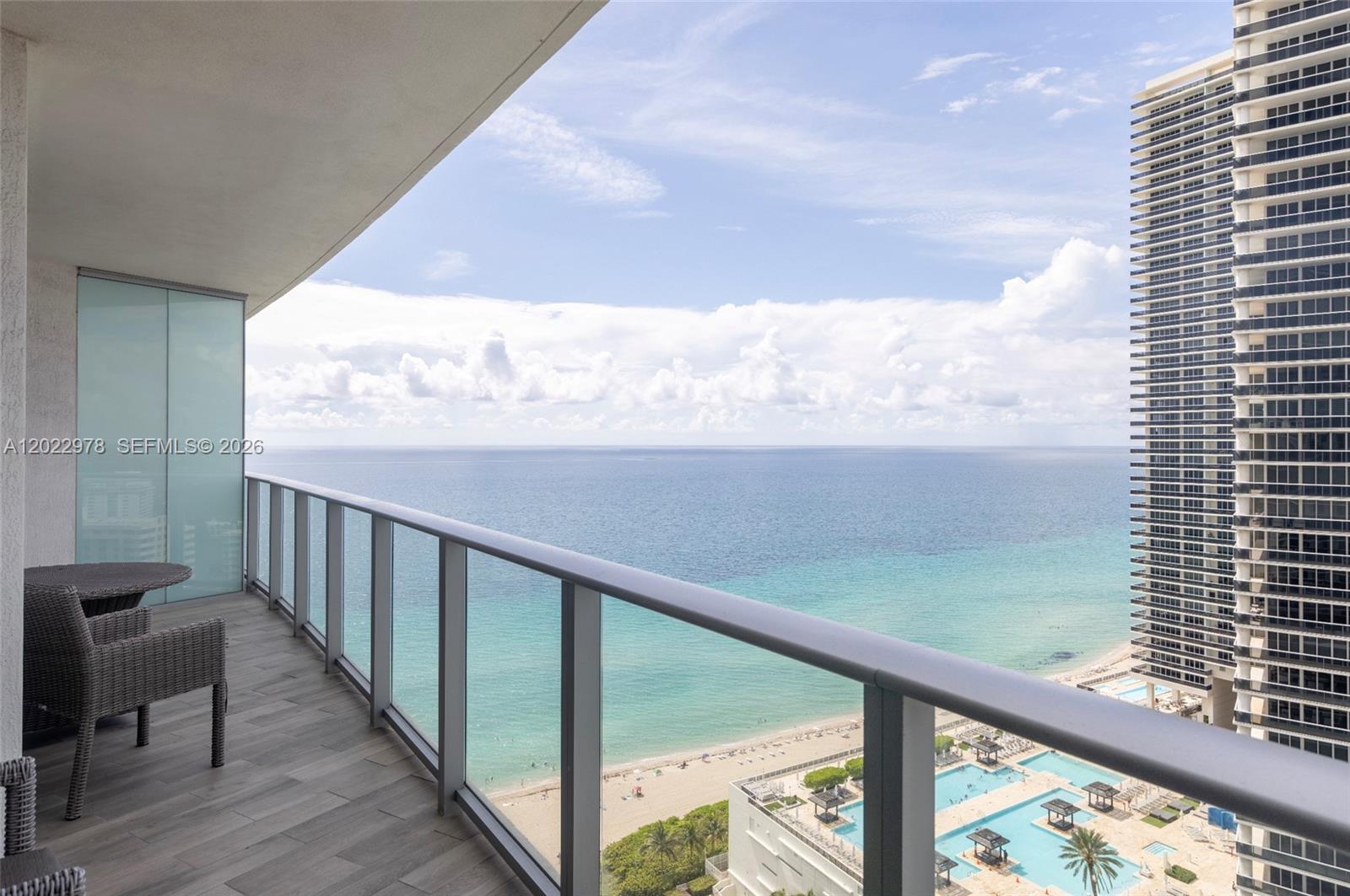 Experience resort-style living at its finest in this stunning 1-bedroom, 1-bathroom oceanfront residence at Lyfe Resort & Residences in Hallandale Beach. Set on the 22nd floor, this 841 SF unit offers breathtaking direct ocean views from a private balcony, filling the space with natural light and coastal elegance. The open-concept layout features a fully equipped modern kitchen with premium Bosch appliances, sleek cabinetry, and designer finishes throughout. Polished porcelain tile floors, floor-to-ceiling sliding glass doors, and curated artwork complete the sophisticated aesthetic. | Lyfe delivers a true five-star lifestyle with world-class amenities including 24-hour security and concierge, beach service, oceanfront pool, full-service spa, state-of-the-art fitness center, on-site dining, and valet parking. Whether you're seeking a personal retreat or a high-performing investment, this unit checks every box - short-term rentals, Airbnb, and VRBO are all permitted, offering exceptional income flexibility in one of South Florida's most sought-after beachfront destinations. A rare opportunity to own a turnkey oceanfront asset that delivers both lifestyle and returns. Seller financing available at 50% LTV, 9% interest rate, with a 2-year balloon.