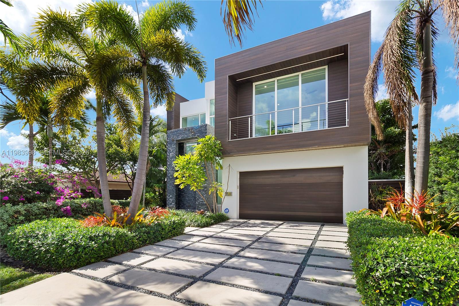 MOTIVATED SELLER - PRICED TO SELL! The BEST Deal For A Waterfront Home! Presenting A Luxurious Contemporary Home Built In 2018. Tastefully Decorated By Interior Designer. 4 Smart TVs. This Custom House Has High-Quality Finishes, 25 Ft. Ceilings, Featuring An Abundance Of Windows & Doors That Bring The Outdoors In, 2-Story Modern Home With Natural Light & Showcasing The Tropical Setting. Kitchen Has Top-Of-The-Line Appliances, Lots Of Storage, Making It A Chef's Dream. An Outdoor Patio & Summer Kitchen. Anti-Mosquito System, Custom LED Lights. The Primary Bedroom On The First Floor Has Gorgeous Views Of The Pool & Water. 70 Feet Of Water Frontage & Access To The Ocean. This House Is Located On A Quiet Street, Offering Privacy and Tranquility. Just Minutes Away From Trader Joe's, Whole Foods & Newly Opened Pura Vida!