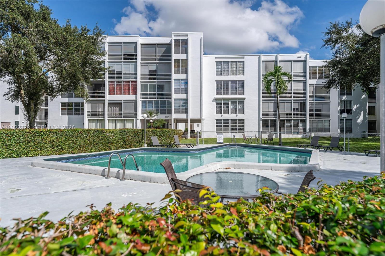 YOU WILL FALL IN LOVE THE MOMENT YOU WALK IN TO THIS BEAUTIFUL, ONE OF A KIND,  CREATIVE, ARTISTIC, UNIQUE CONDO. IMMACULATE, AIRY, LIGHT AND BRIGHT THROUGHOUT. OPEN SPACIOUS FLOOR PLAN.  UPGRADES GALORE! IMPACT WINDOWS. NEW ROOF, ACCORDION/ELECTRIC SHUTTERS, BRAND NEW LAMINATED FLOORS, NEWER AC ,NEWER WATER HEATER AND MORE. SPECTACULAR FORMAL DINING ROOM, INVITING LARGE LIVING ROOM, AMPLE SIZED BEDROOMS. MASTER BEDROOM HAS TWO CLOSETS & CLOSETS IN BOTH BEDS HAVE BUILT INS. PEACEFUL AND TRANQUIL EXSPANSIVE SCREENED PATIO. BRIGHT AND OPEN SPACIOUS KITCHEN WITH LOTS OF CABINETS AND COUNTER TOPS-GREAT FOR COOKING. UPGRADED LIGHT FIXTURES, EXTERIOR STORAGE UNIT-LOTS OF STORAGE SPACE!  CLOSE TO RESTURANTS, ENTERTAINMENT, PARKS, MAJOR ROADWAYS AND MORE. 20 MINUTES TO FT LAUD AIRPORT.  COMMUNITY HEATED POOL.