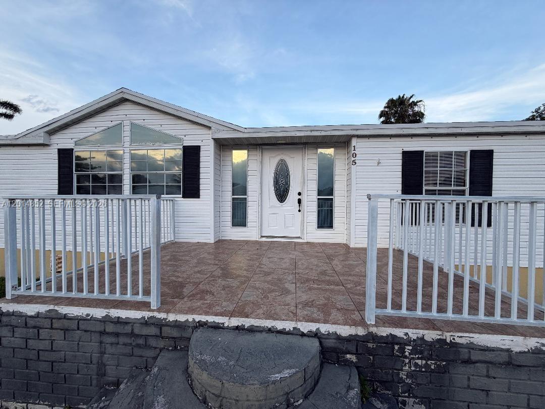 Just Listed one of the most desired properties in Americana Village. This property is the largest models 3 bedroom 2 bath plus office/den can be 4th bedroom on an oversized lot. Property has plenty of parking with circular driveway plus driveway under roof great for parking on rainy days or boat space. This Home features a split plan which includes a large master bedroom with a large bathroom including shower and roman tub laminate throughout, fire place and large kitchen with island for that chef in you. Laundry room inside leads out to overlarge screen terrace in back and plenty of yard for kids to play . Back yard includes multiple fruit trees and a nice shed to store your tools. This property will not last, land is included with sale .