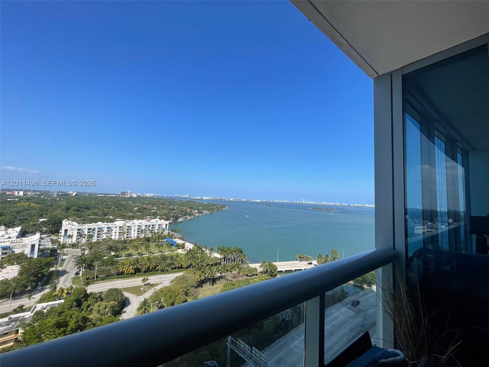 Experience elevated living in this elegant 1-bedroom, 1.5-bath residence with beautiful Intracoastal views from the 17th floor. Walls of hurricane-impact glass open to a private balcony, filling the space with natural light and showcasing serene water vistas. This well-appointed condo features wood floors, a modern kitchen with stainless steel appliances, an in-unit washer and dryer, a spacious bedroom with floor-to-ceiling windows, and updated bathrooms, including a stylish powder room for guests. Ideally located with convenient access to major highways, shopping, dining, and nearby beaches, this residence offers both comfort and accessibility. Enjoy resort-style amenities including a pool, fitness center, movie room, billiard room, concierge services, and secure assigned garage parking. A great opportunity to own a beautifully finished condo with impressive views in a prime location. Schedule your private tour today.