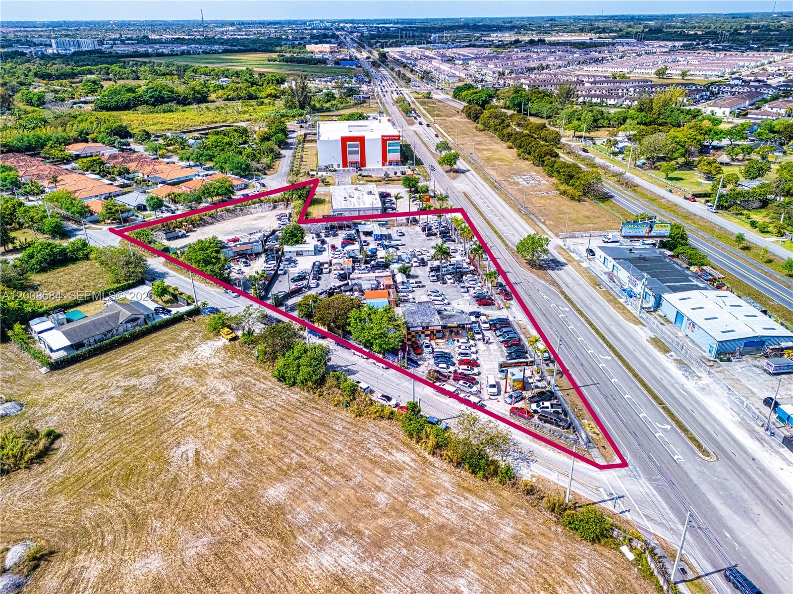 GROUND LEASE OPPORTUNITY-ALSO FOR SALE:  MLS: A11787665
Incredible covered land play or redevelopment opportunity on So Dixie Hwy, between Cutler Bay and Homestead, on SW 124 Avenue. This 2.5+ acre BU-3 zoned site is currently leased to small car dealers.BU-3 zoning, while excluding office use, does allow Wholesale Facilities, Spot commercial, Strip commercial, and neighborhood shopping centers. This liberal commercial zoning allows for the possibility of applying the Live Local Act, which would facilitate residential use as part of the redevelopment. The Florida Live Local Act aims to address the state's affordable housing crisis by providing various incentives and opportunities for developers to create workforce housing. It offers funding, land-use flexibility, and tax benefits to encourage the construction of affordable rental housing units.